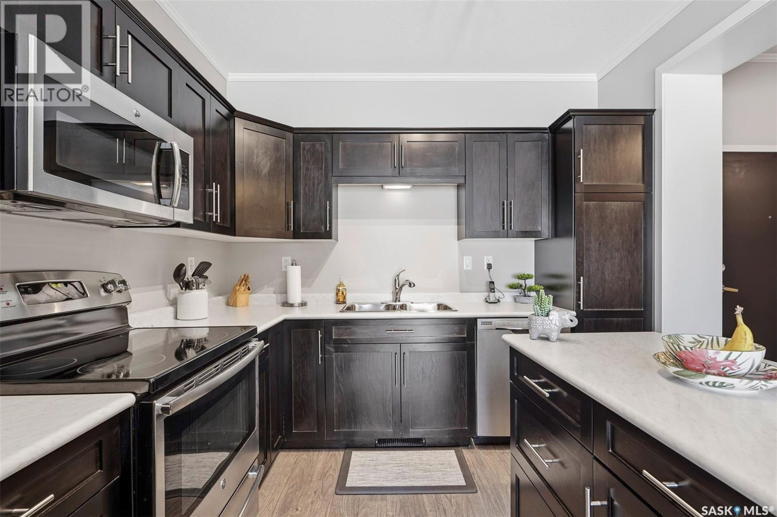 113 545 Hassard Close, Saskatoon, SK - Indoor Photo Showing Kitchen With Stainless Steel Kitchen With Double Sink