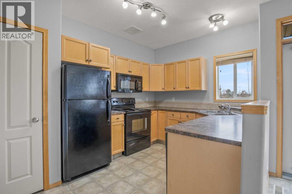 1 Ivey Close, Red Deer, AB - Indoor Photo Showing Kitchen With Double Sink