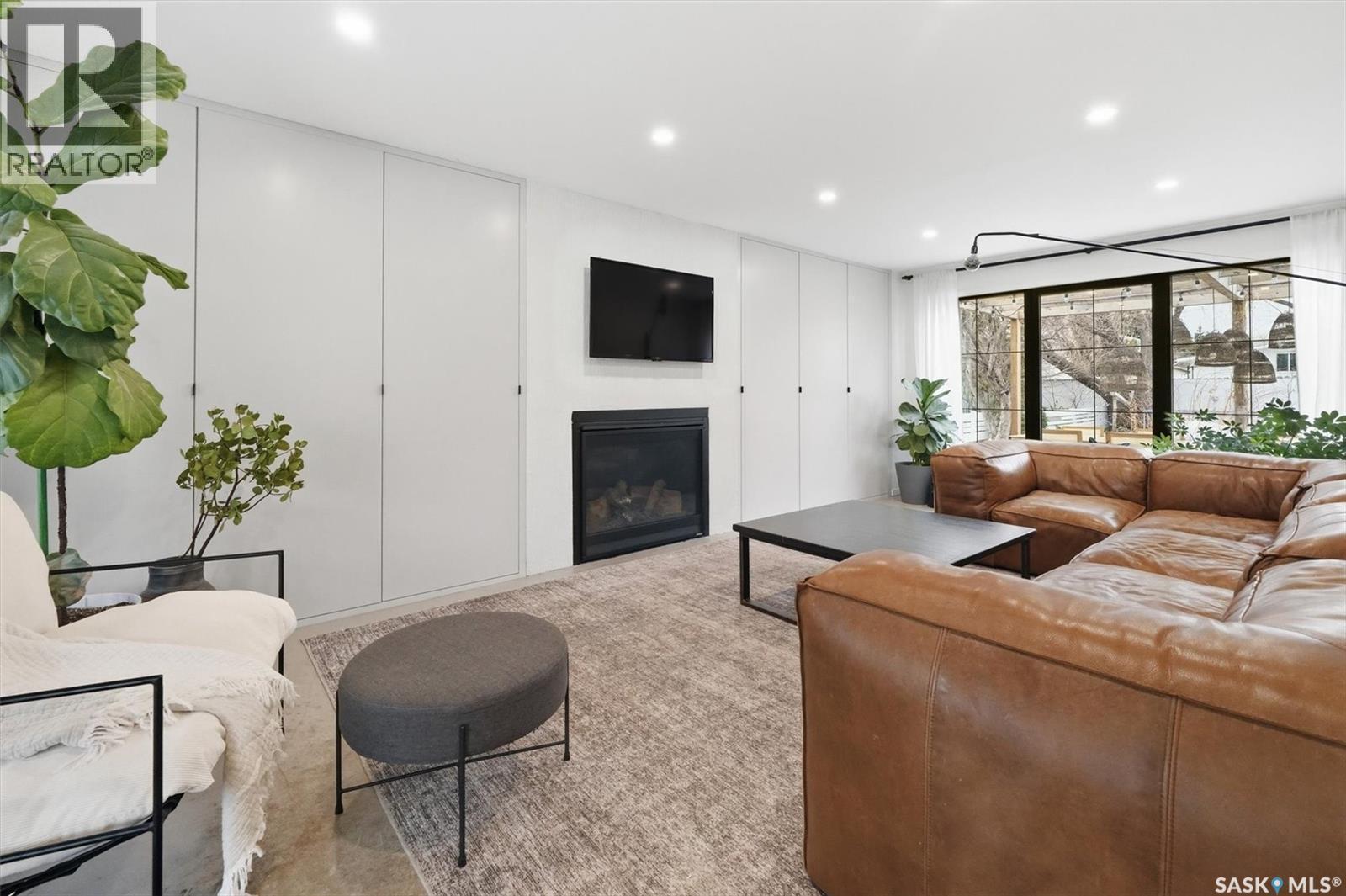 3610 Balfour Court, Saskatoon, SK - Indoor Photo Showing Living Room With Fireplace