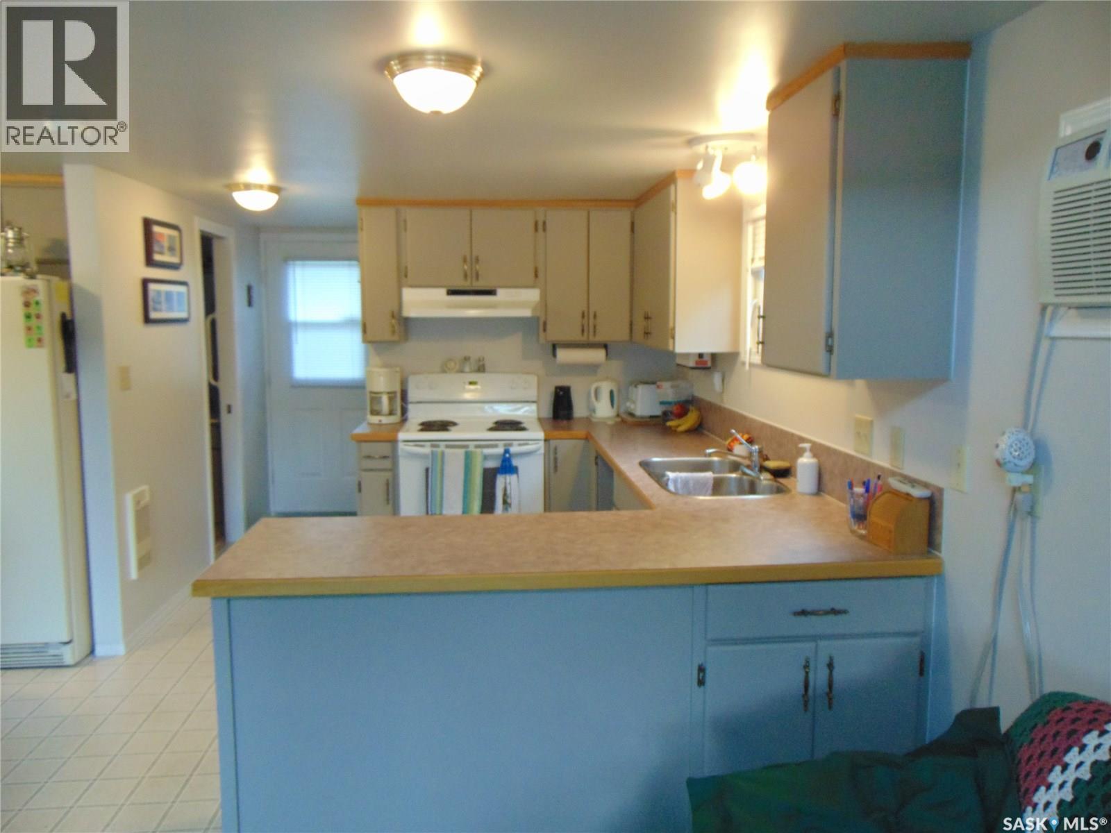 1558 Eagle, Prince Albert National Park, SK - Indoor Photo Showing Kitchen With Double Sink