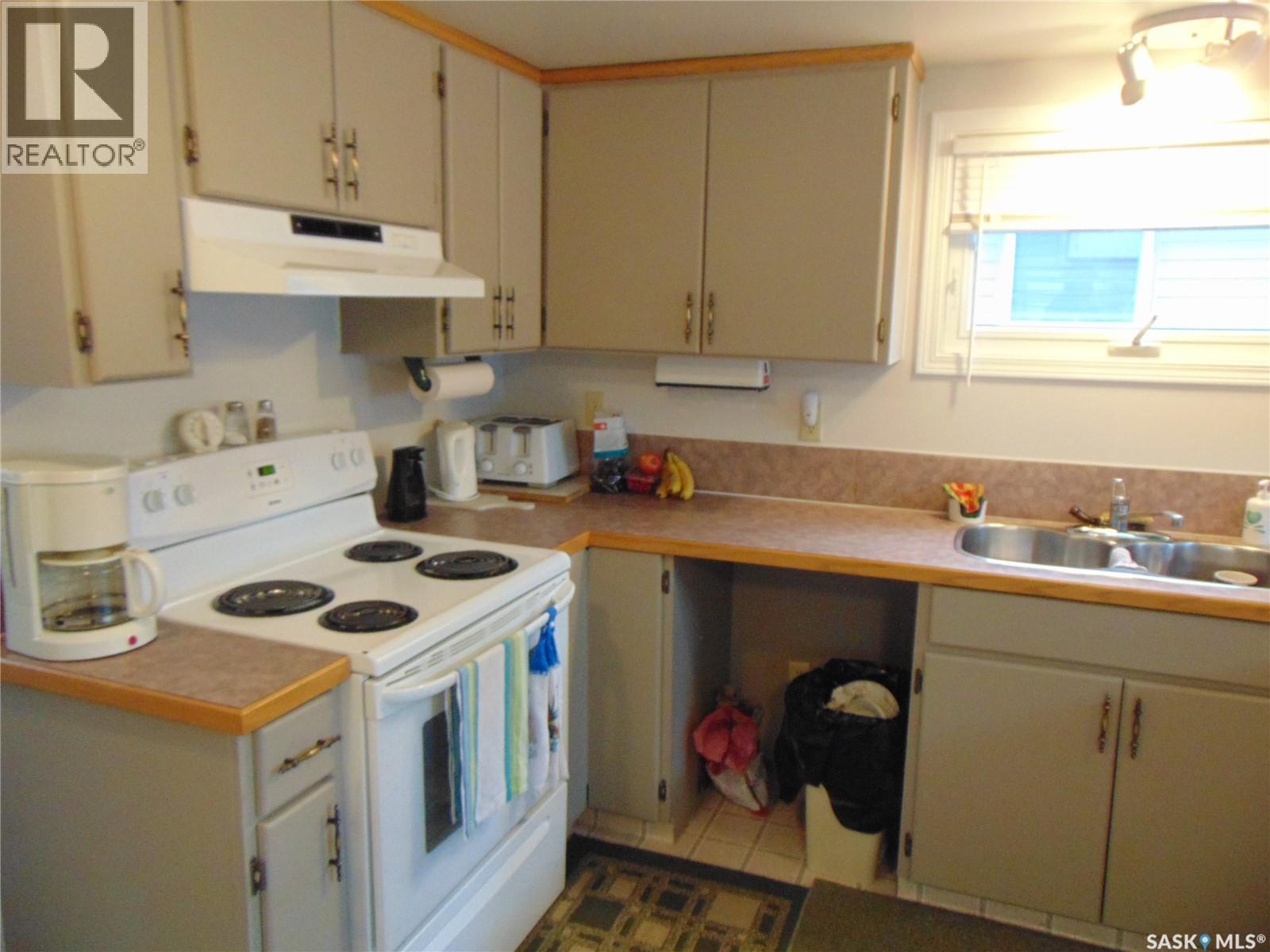 1558 Eagle, Prince Albert National Park, SK - Indoor Photo Showing Kitchen With Double Sink