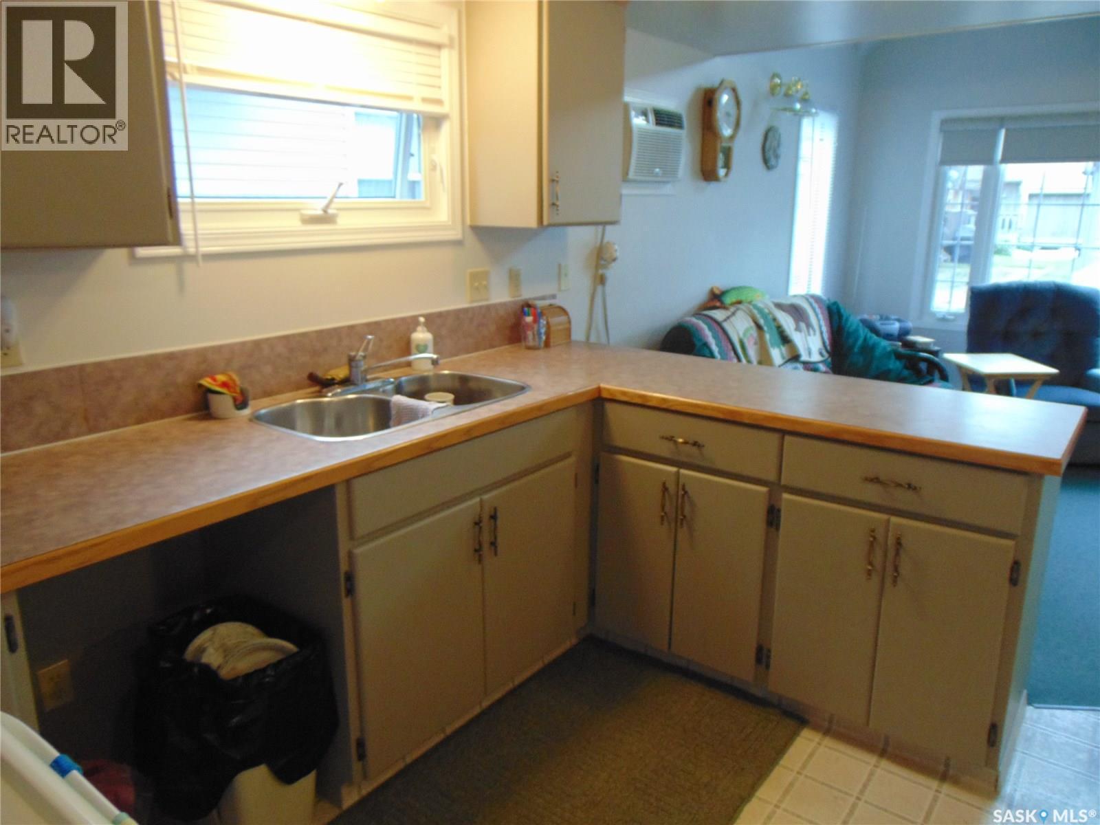 1558 Eagle, Prince Albert National Park, SK - Indoor Photo Showing Kitchen With Double Sink