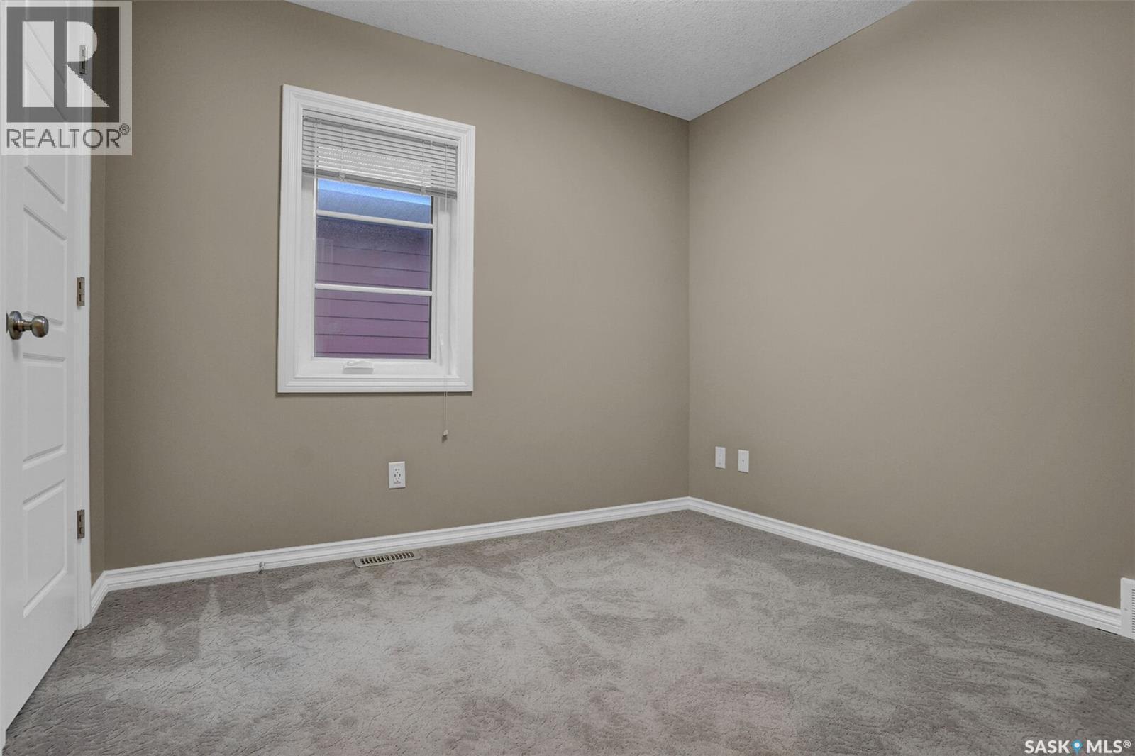 124 3229 Elgaard Drive, Regina, SK - Indoor Photo Showing Other Room