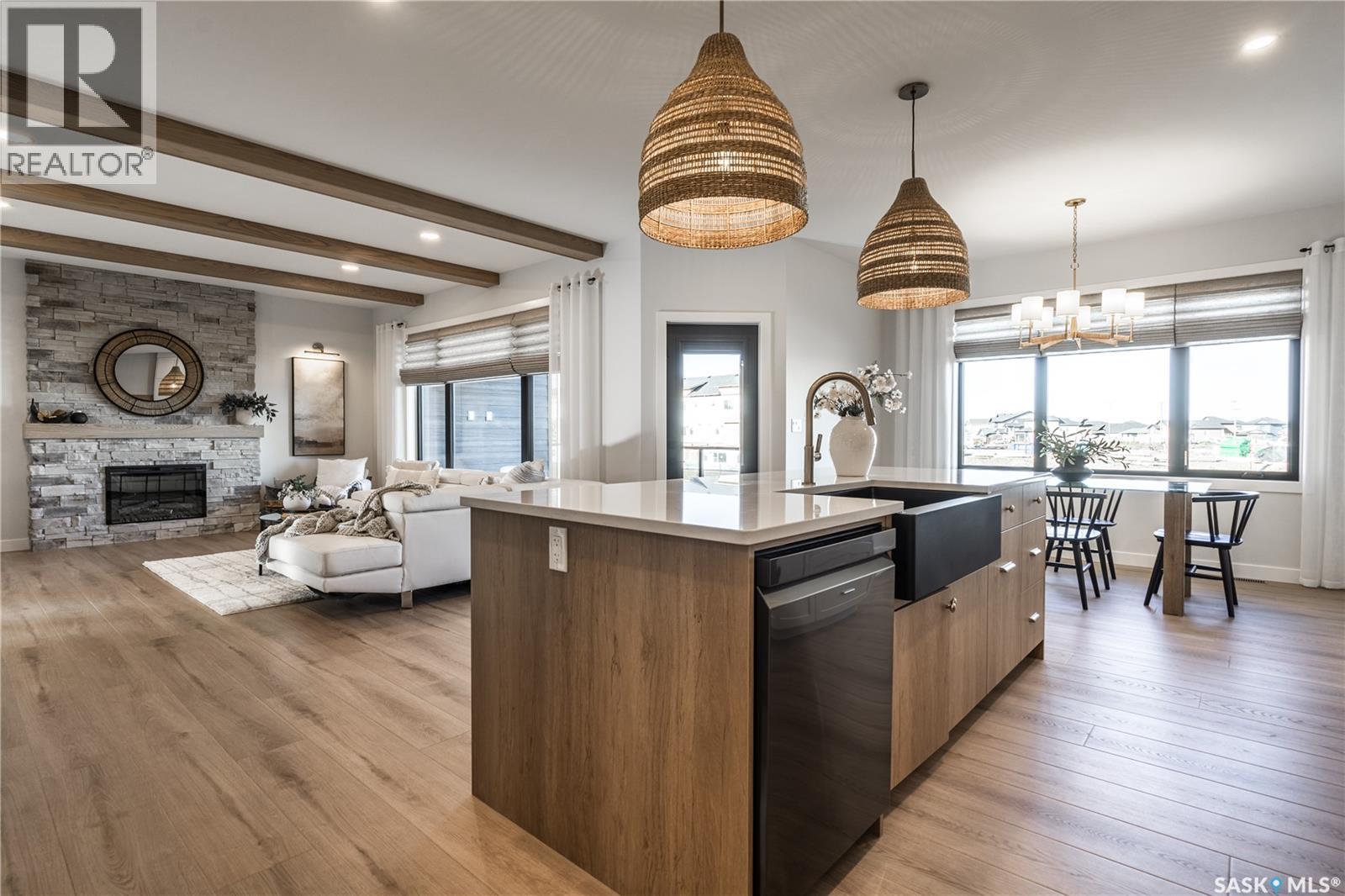 415 Sharma Crescent, Saskatoon, SK - Indoor Photo Showing Kitchen With Fireplace With Upgraded Kitchen