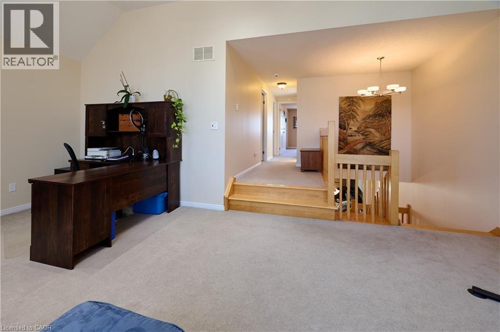Office featuring light colored carpet, a chandelier, and vaulted ceiling - 126 Snowdrop Crescent, Kitchener, ON - Indoor
