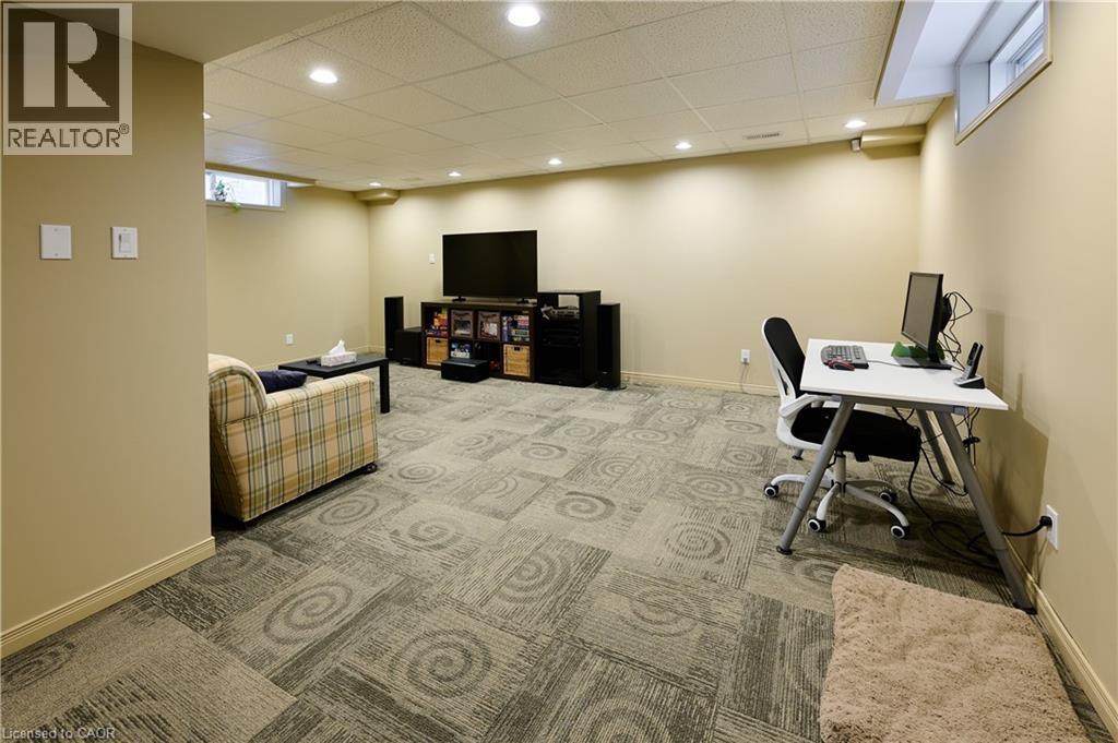 Office area featuring light colored carpet, a drop ceiling, and recessed lighting - 126 Snowdrop Crescent, Kitchener, ON - Indoor