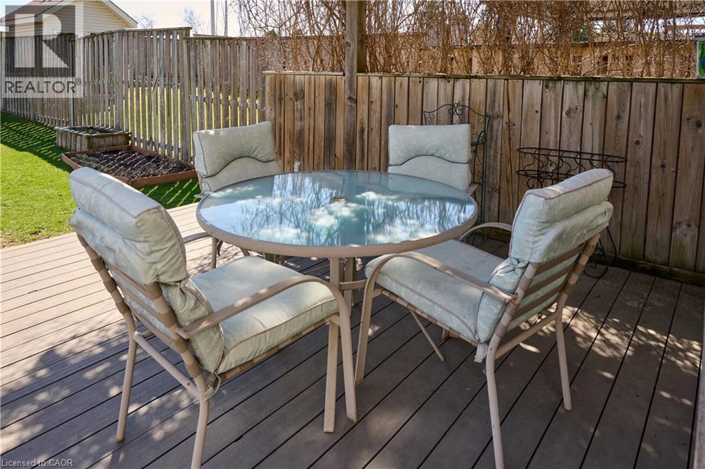 Deck with outdoor dining area and a fenced backyard - 126 Snowdrop Crescent, Kitchener, ON - Outdoor With Deck Patio Veranda
