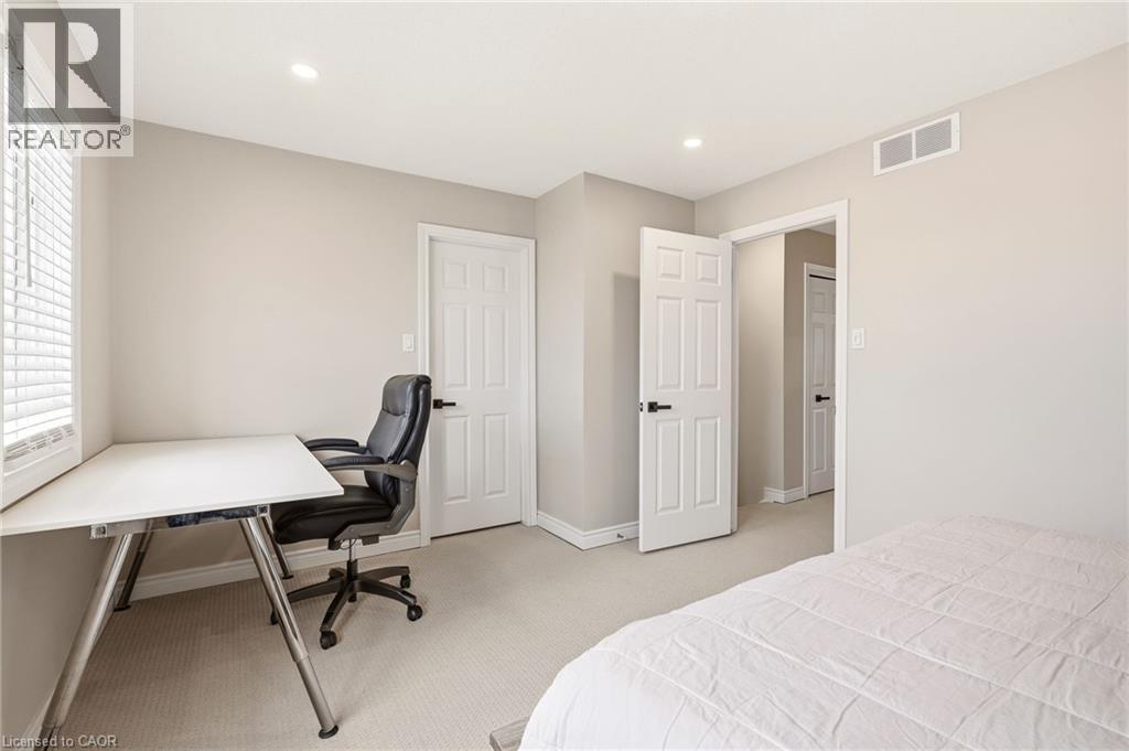 A bright room featuring light-colored walls, recessed lighting, and carpeted flooring - 1 Tomahawk Drive, Grimsby, ON - Indoor Photo Showing Bedroom
