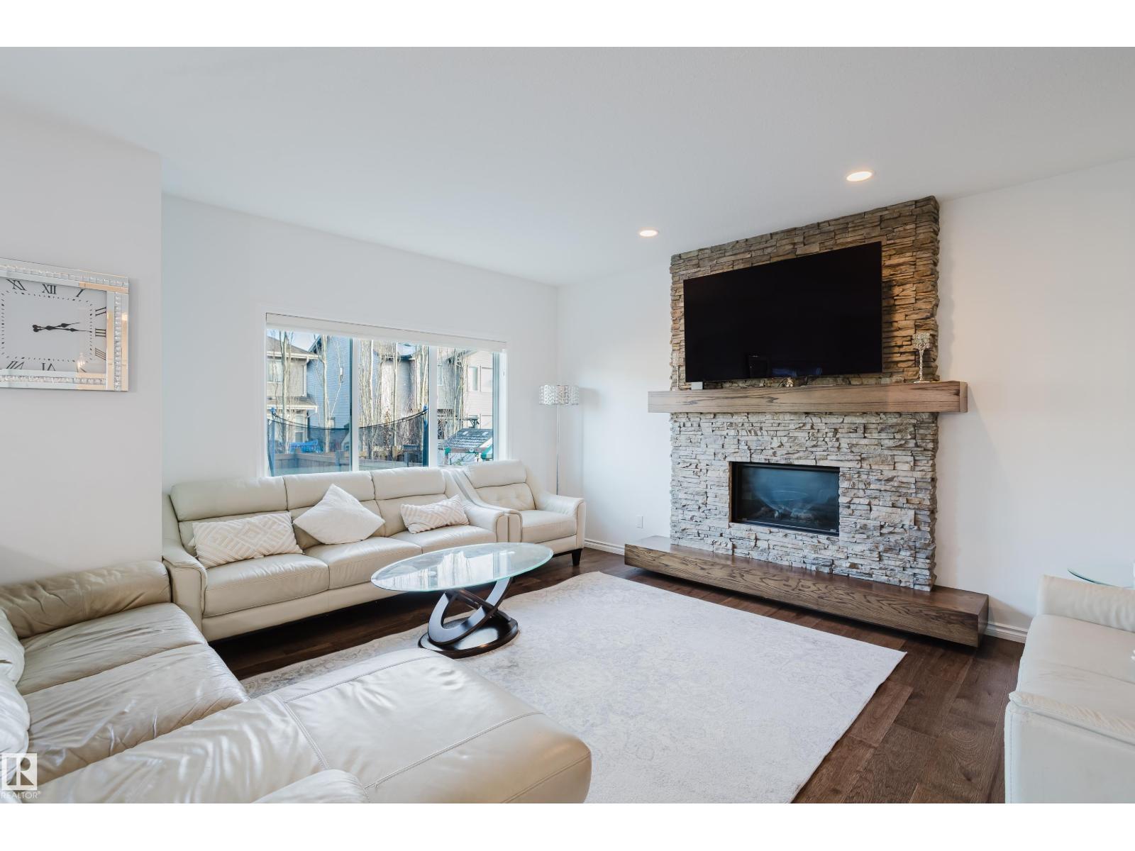 17539 61 St Nw, Edmonton, AB - Indoor Photo Showing Living Room With Fireplace