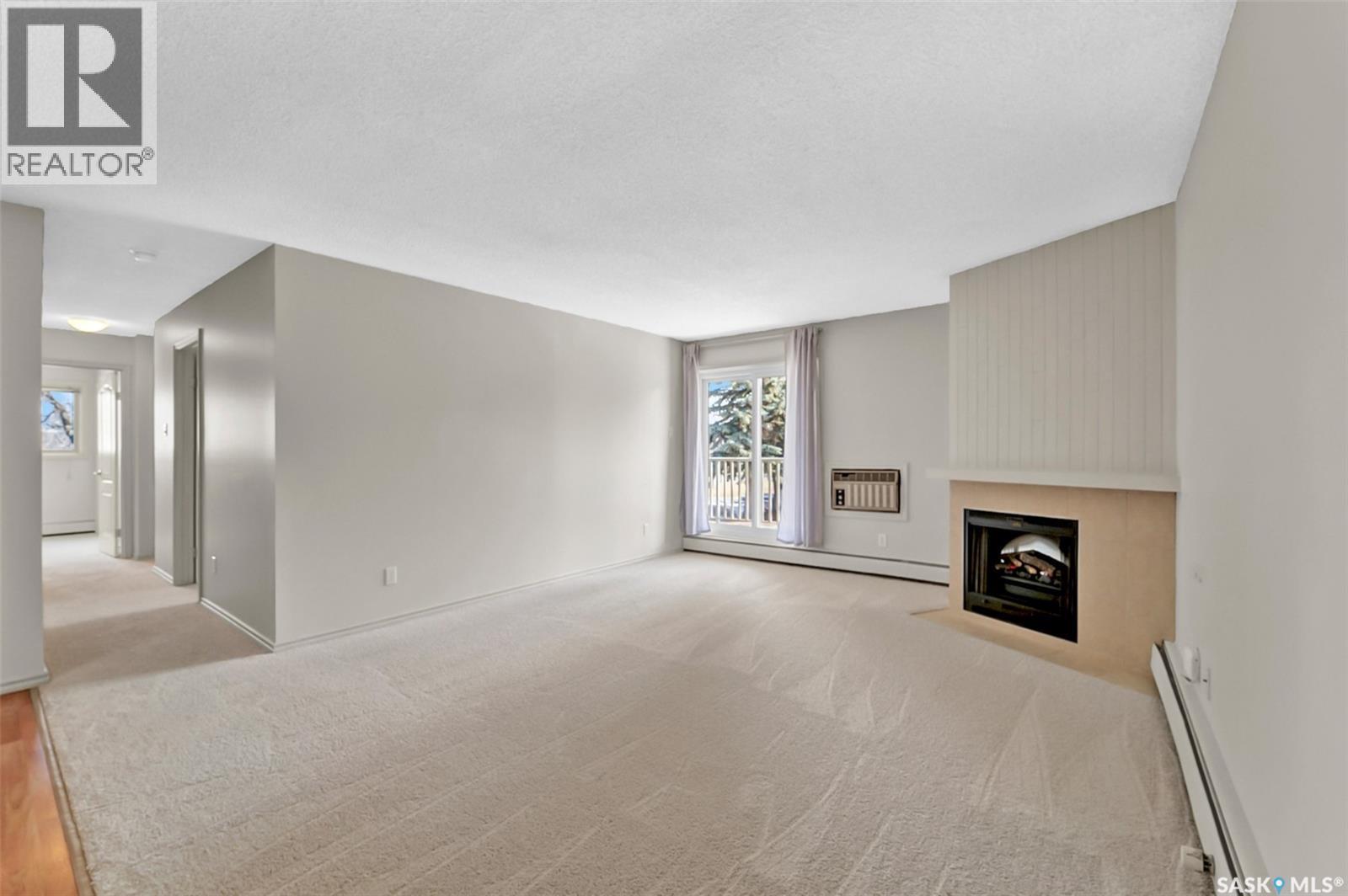 202B 1121 Mckercher Drive, Saskatoon, SK - Indoor With Fireplace