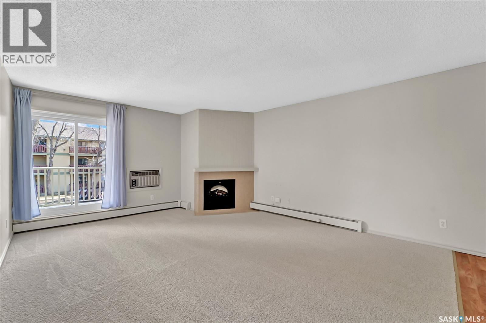 202B 1121 Mckercher Drive, Saskatoon, SK - Indoor With Fireplace