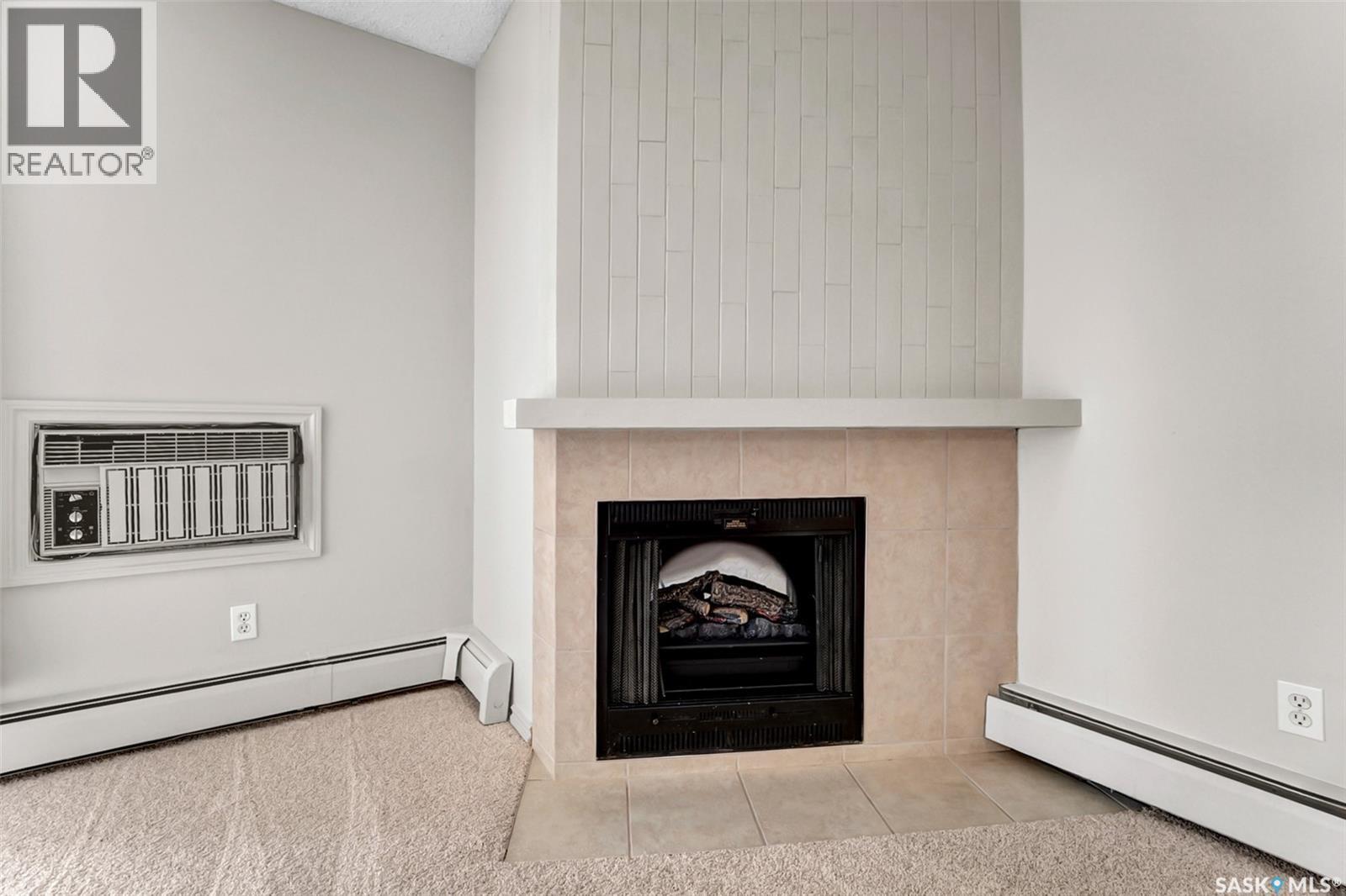 202B 1121 Mckercher Drive, Saskatoon, SK - Indoor With Fireplace