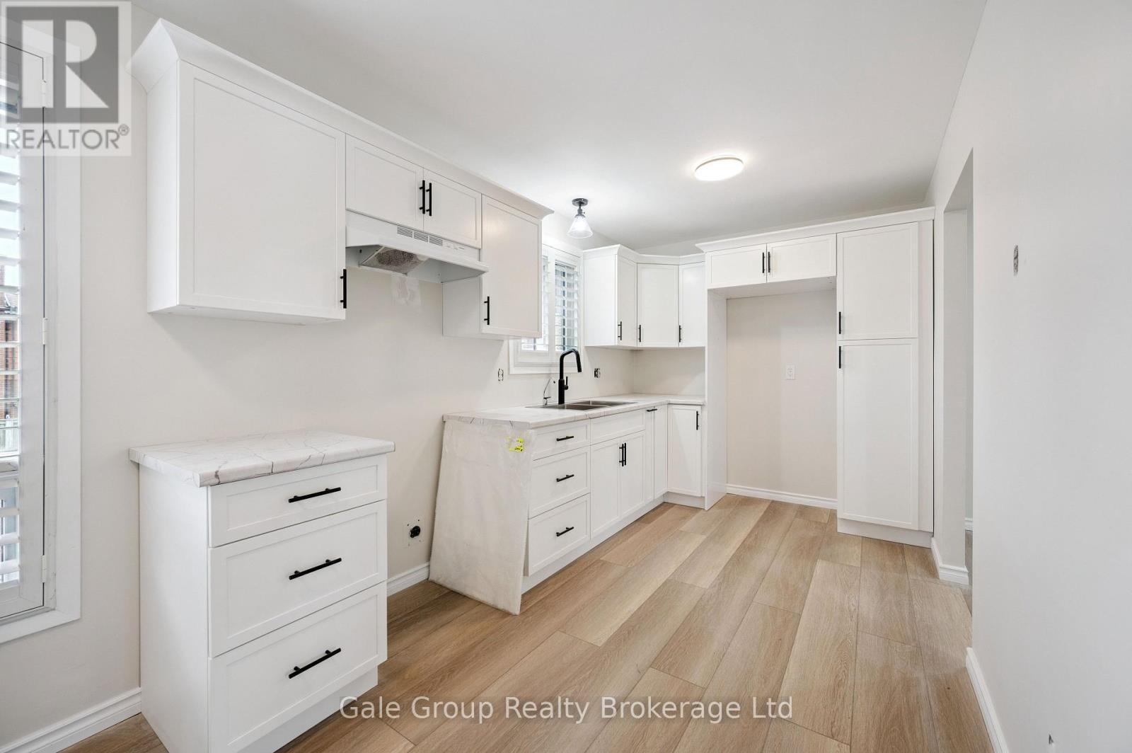 kitchen new flooring - 165 Brookside Crescent, Kitchener, ON - Indoor Photo Showing Kitchen