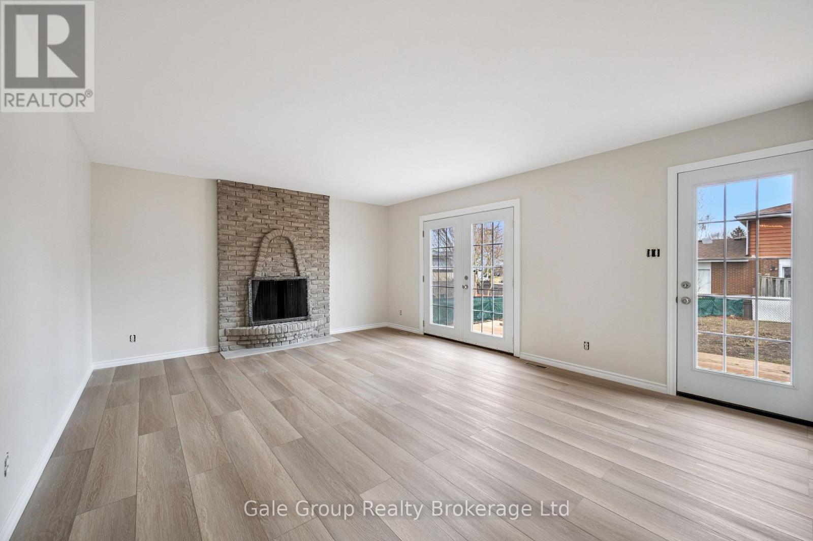 family room - 165 Brookside Crescent, Kitchener, ON - Indoor Photo Showing Living Room With Fireplace