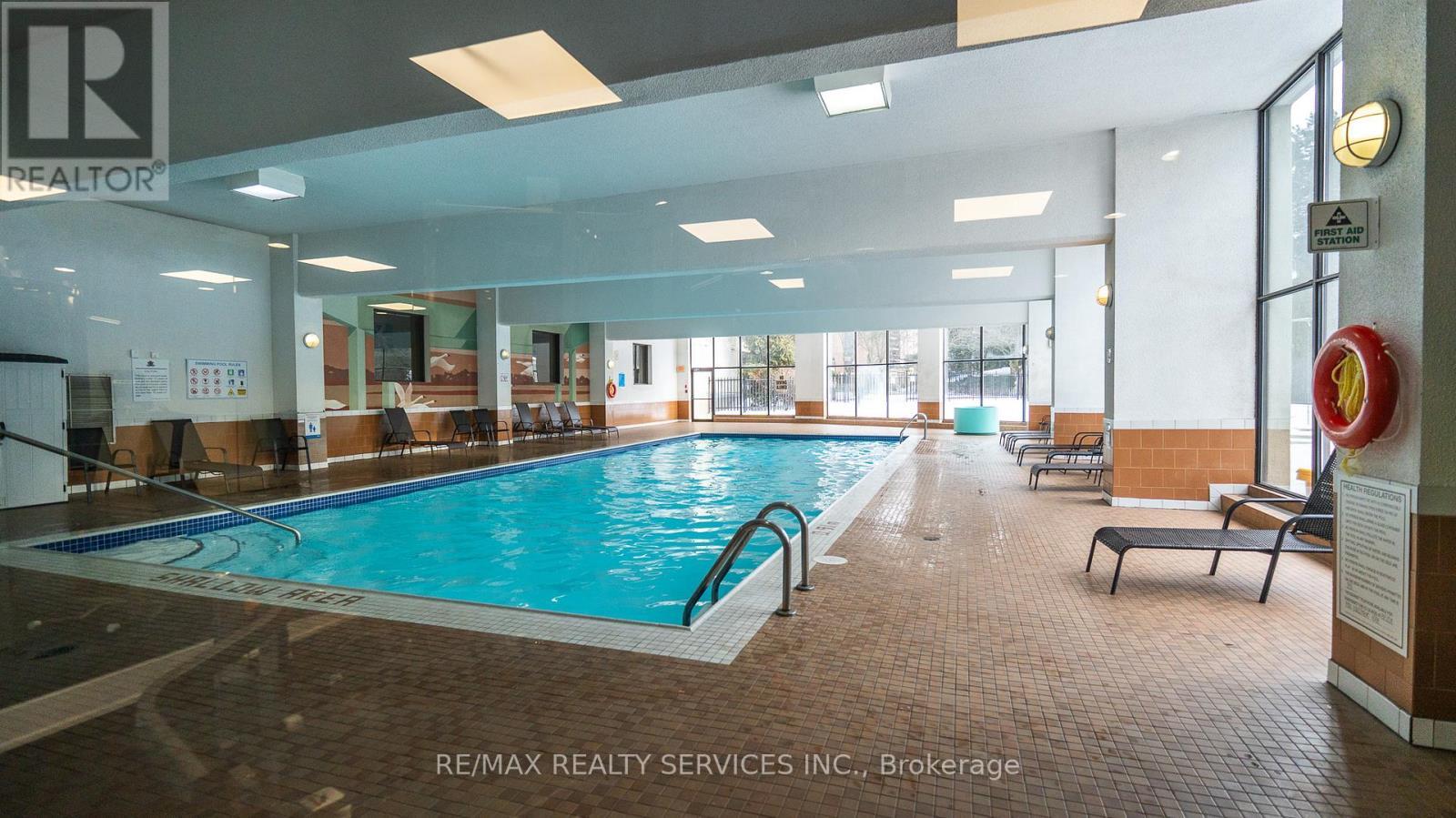 203 - 8 Lisa Street, Brampton, ON - Indoor Photo Showing Other Room With In Ground Pool