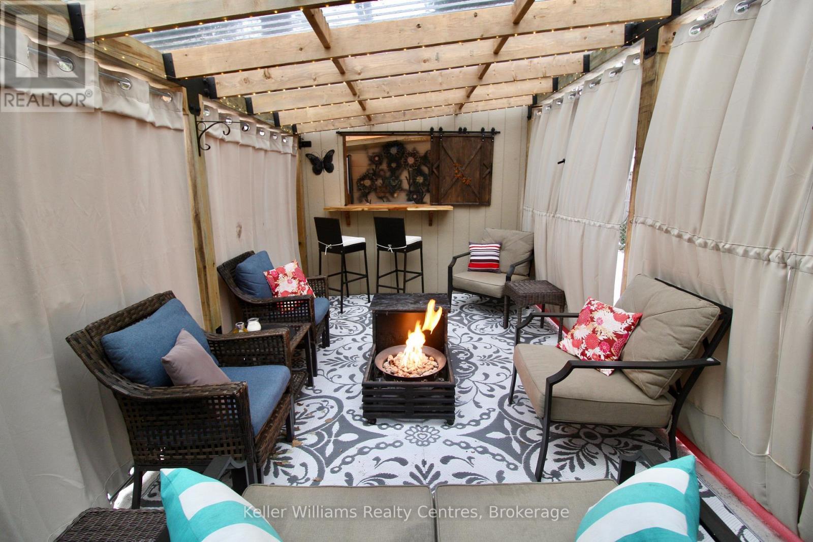 pergola with curtains closed - 471 4Th Street, Hanover, ON - Indoor Photo Showing Other Room