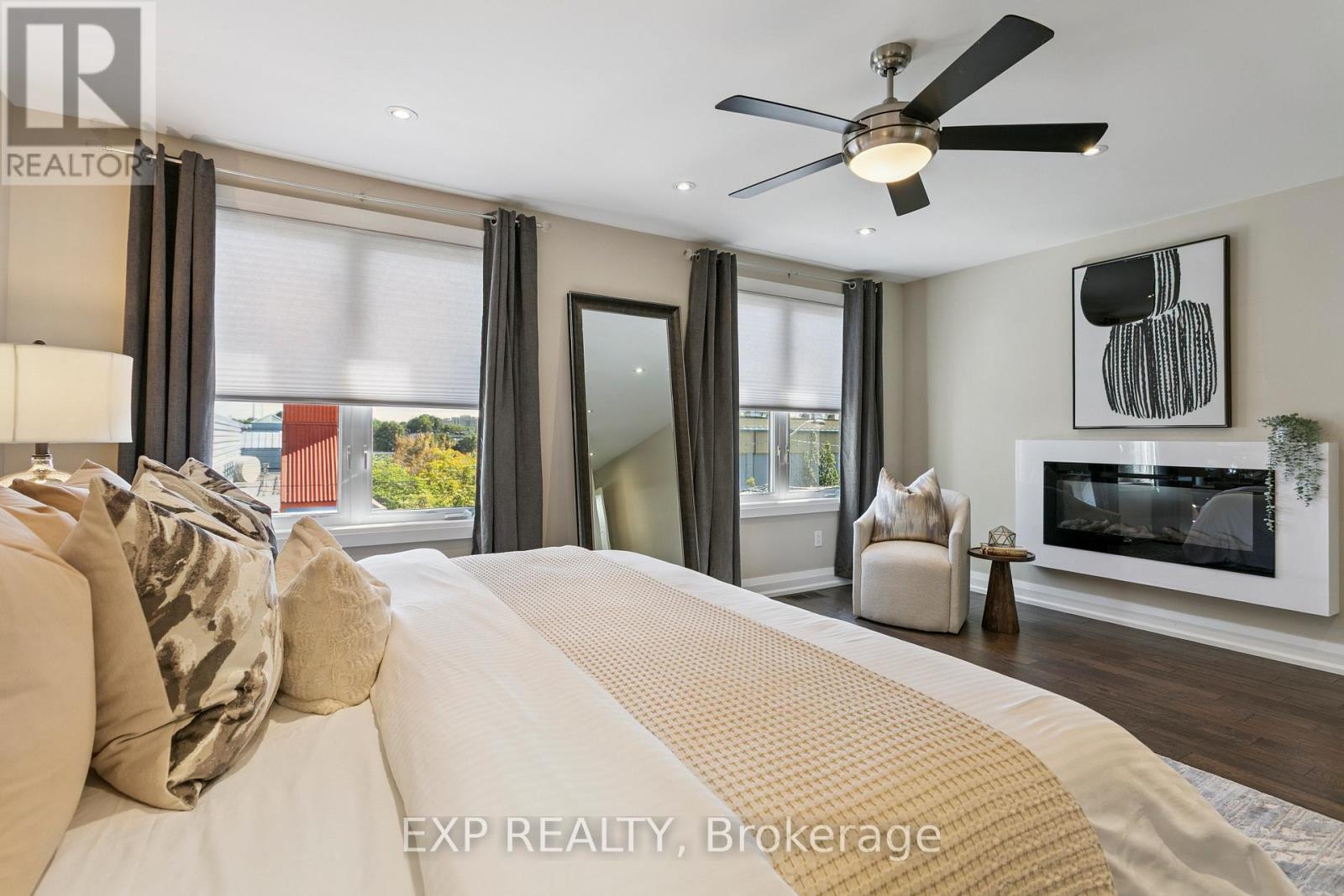 105 Twenty Second Street, Toronto, ON - Indoor Photo Showing Bedroom With Fireplace