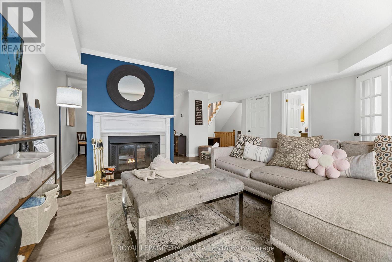 E12 - 1665 Nash Road, Clarington (Courtice), ON - Indoor Photo Showing Living Room With Fireplace