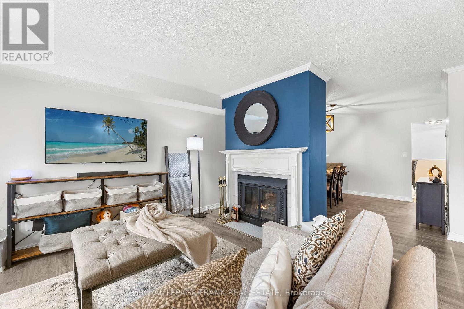 E12 - 1665 Nash Road, Clarington (Courtice), ON - Indoor Photo Showing Living Room With Fireplace