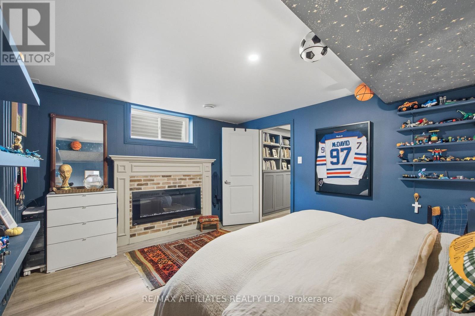 19 Senators Gate Drive, Perth, ON - Indoor Photo Showing Bedroom With Fireplace