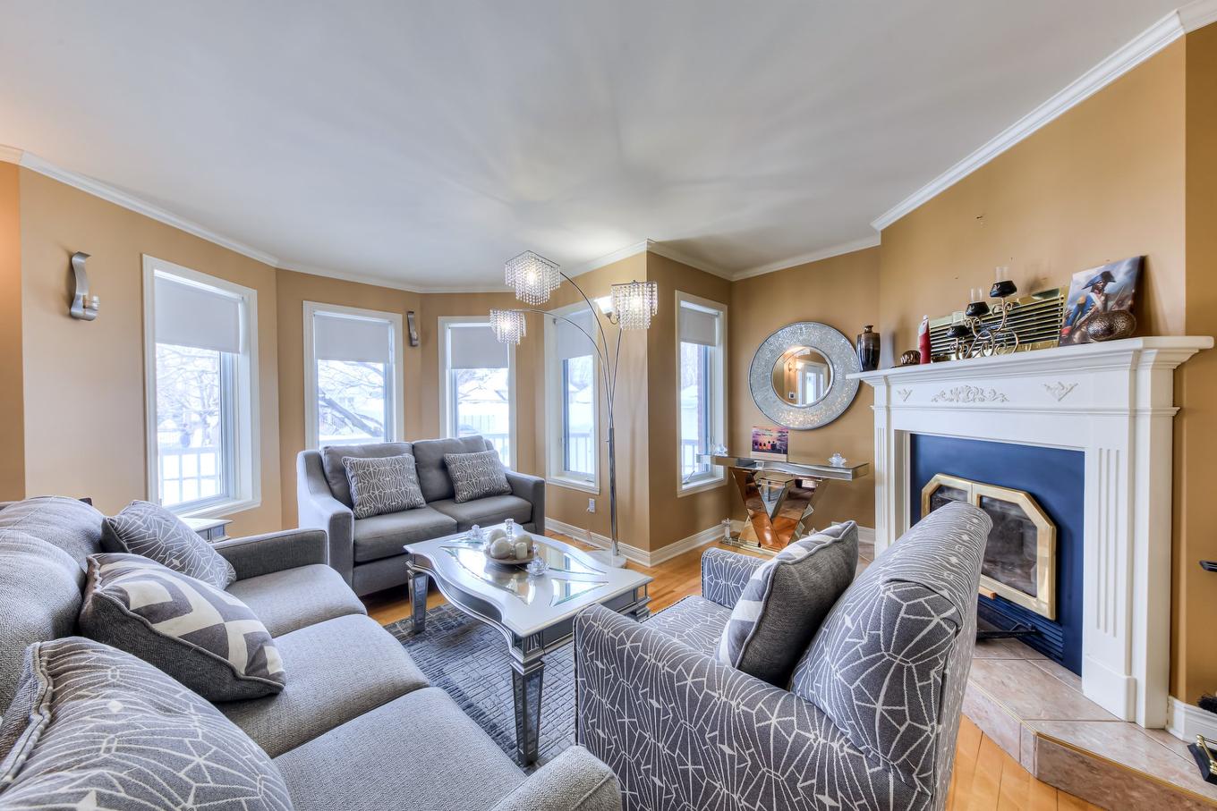 Living room - 20500 Rue Des Sports, Mirabel, QC - Indoor Photo Showing Living Room With Fireplace