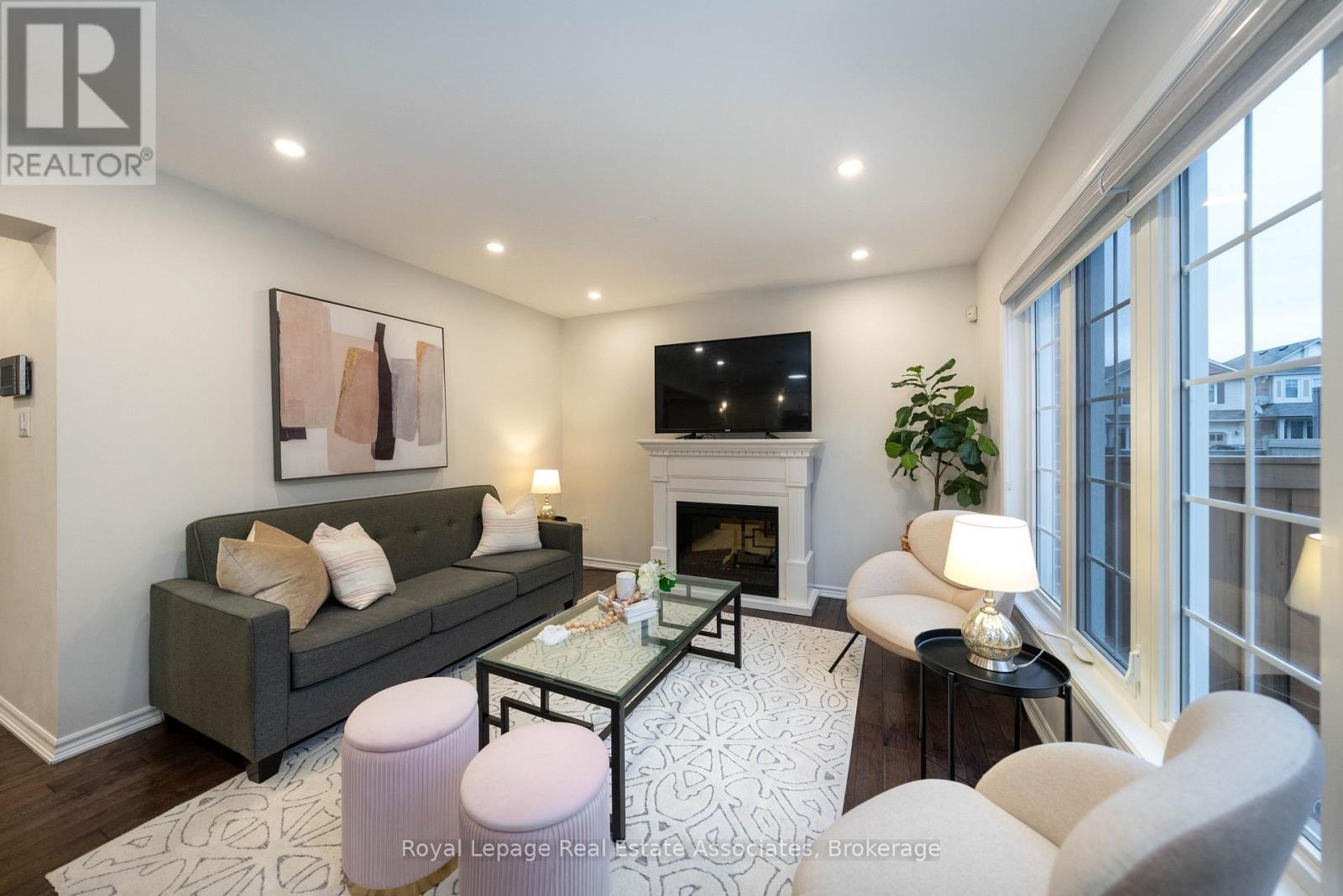 303 Chuchmach Close, Milton, ON - Indoor Photo Showing Living Room With Fireplace