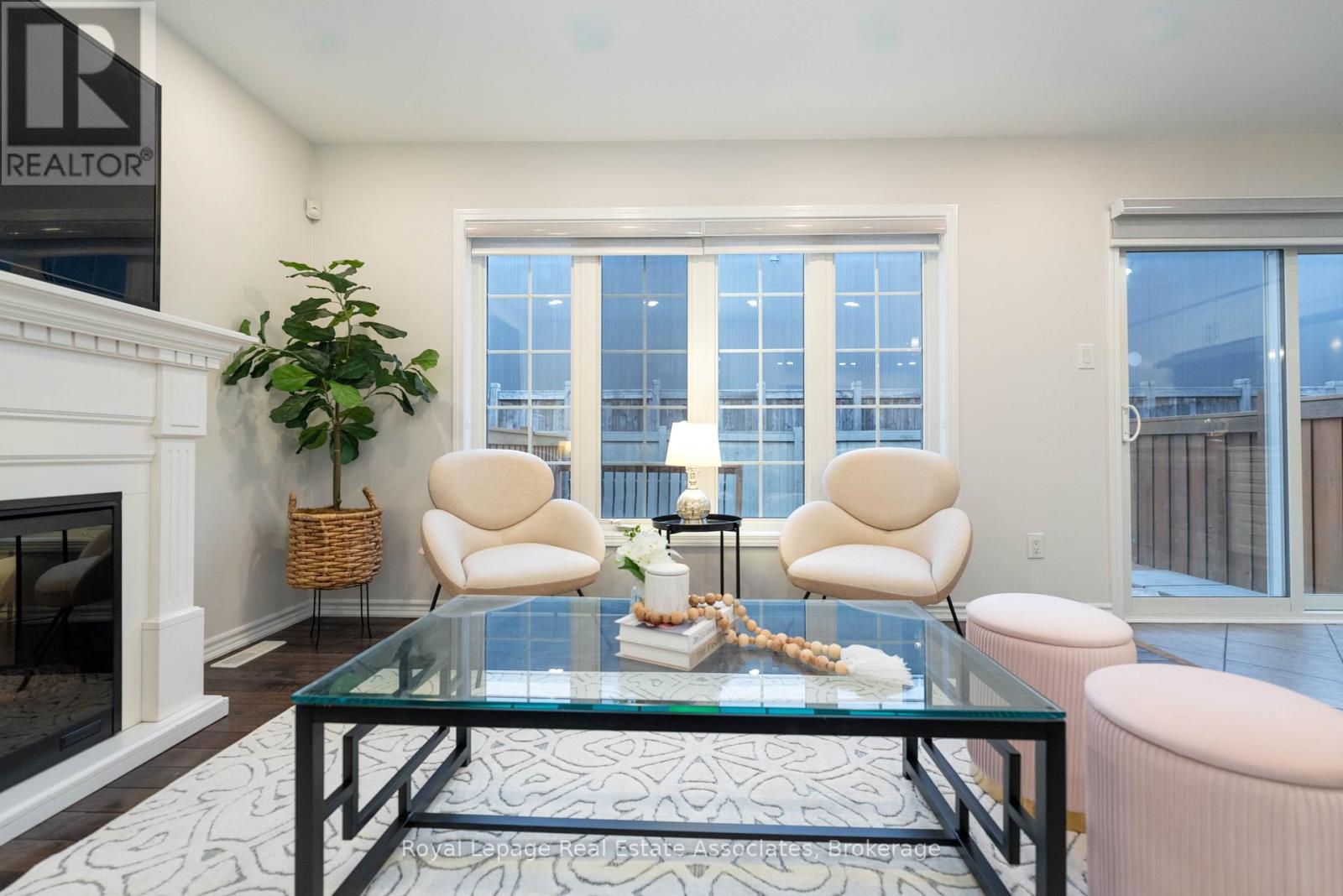 303 Chuchmach Close, Milton, ON - Indoor Photo Showing Living Room With Fireplace