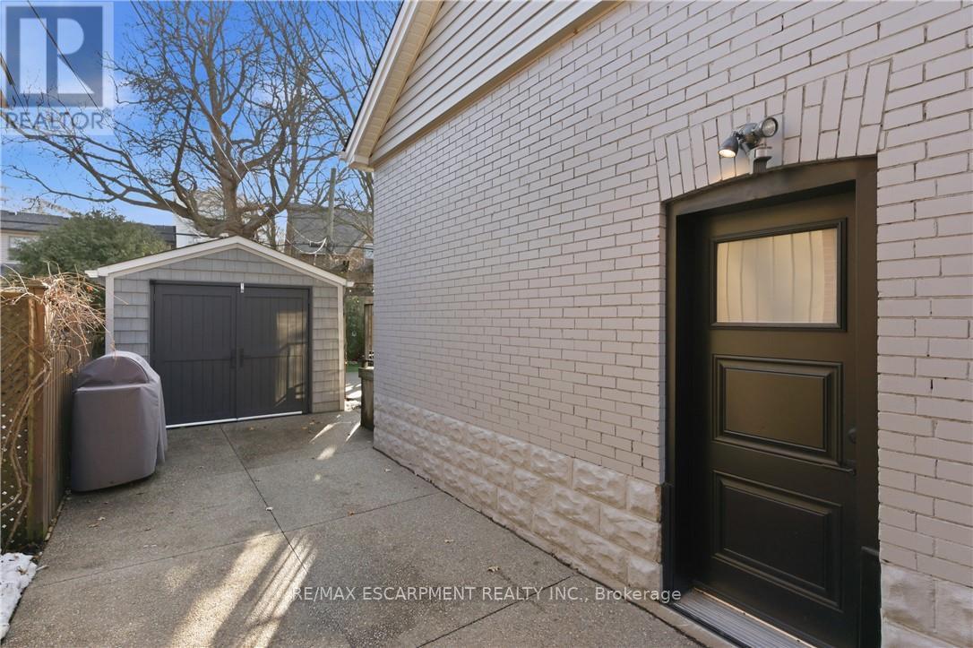Side entrance to basement and single garage - 73 Arkell Street, Hamilton, ON - Outdoor With Exterior