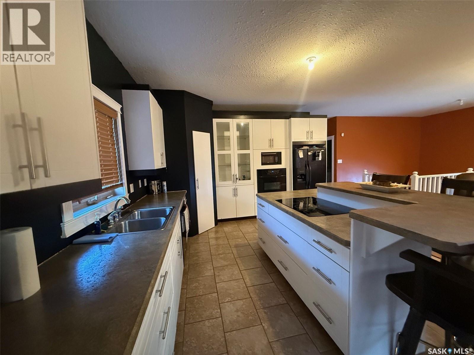1448 Studer Street, La Ronge, SK - Indoor Photo Showing Kitchen With Double Sink