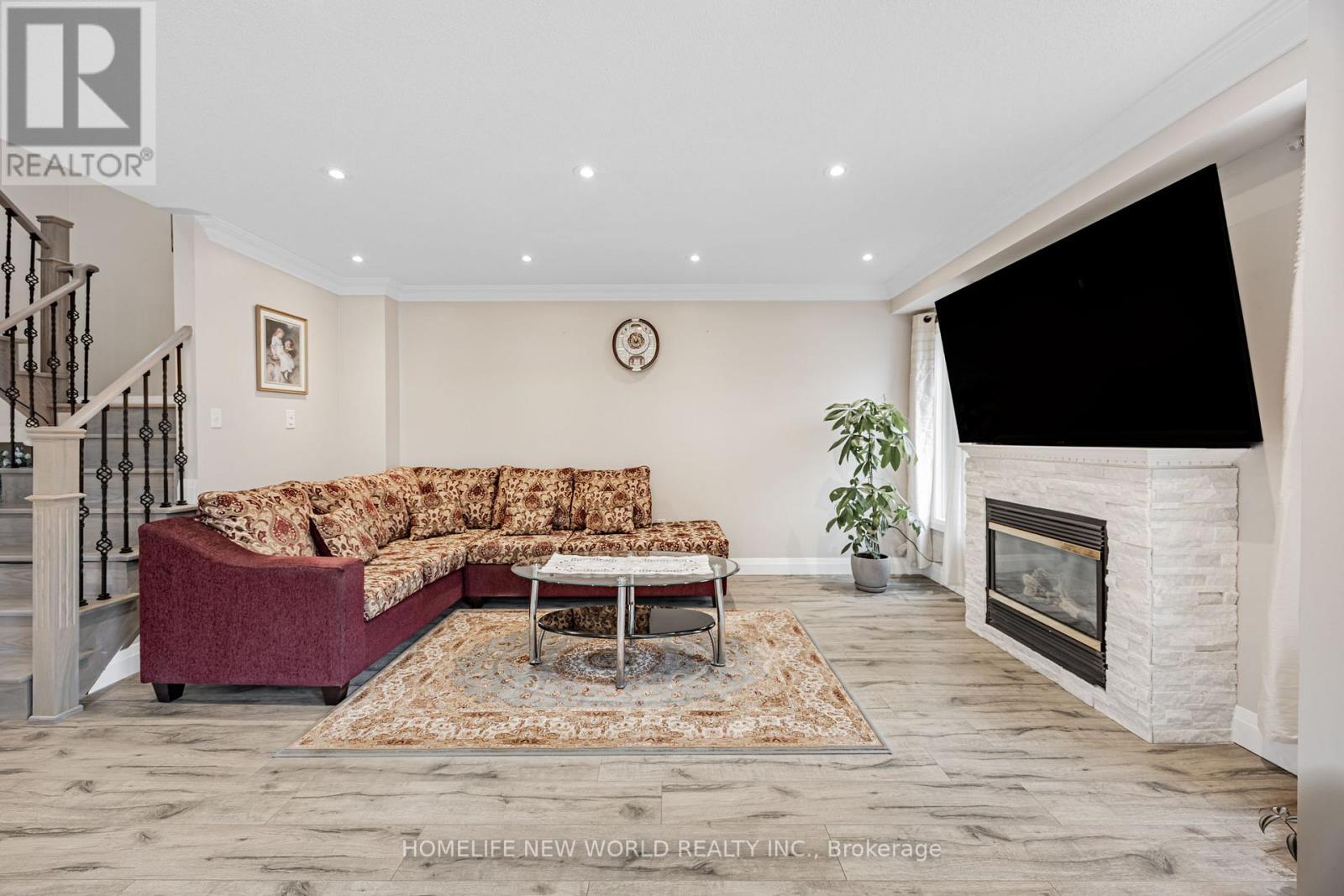 7 Batt Crescent S, Ajax, ON - Indoor Photo Showing Living Room With Fireplace