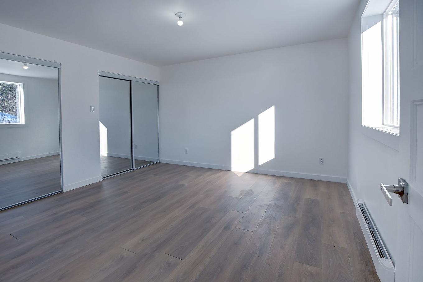 Chambre à coucher principale - 45 Rue Des Pionniers, Saint-Côme, QC - Indoor Photo Showing Other Room