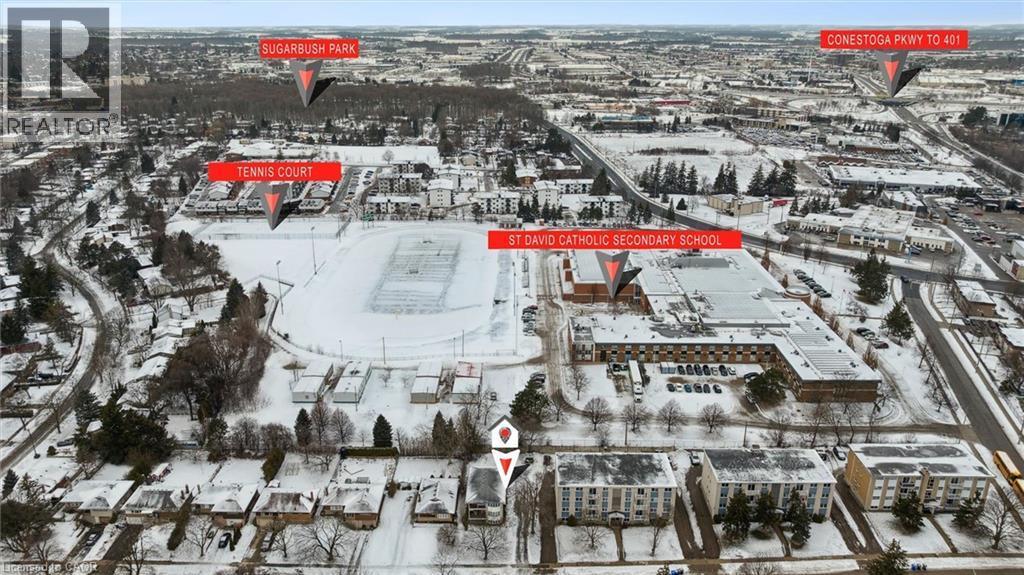 Aerial view highlighting the property's proximity to a park, tennis courts, and a secondary school - 24 Austin Drive, Waterloo, ON - Outdoor With View