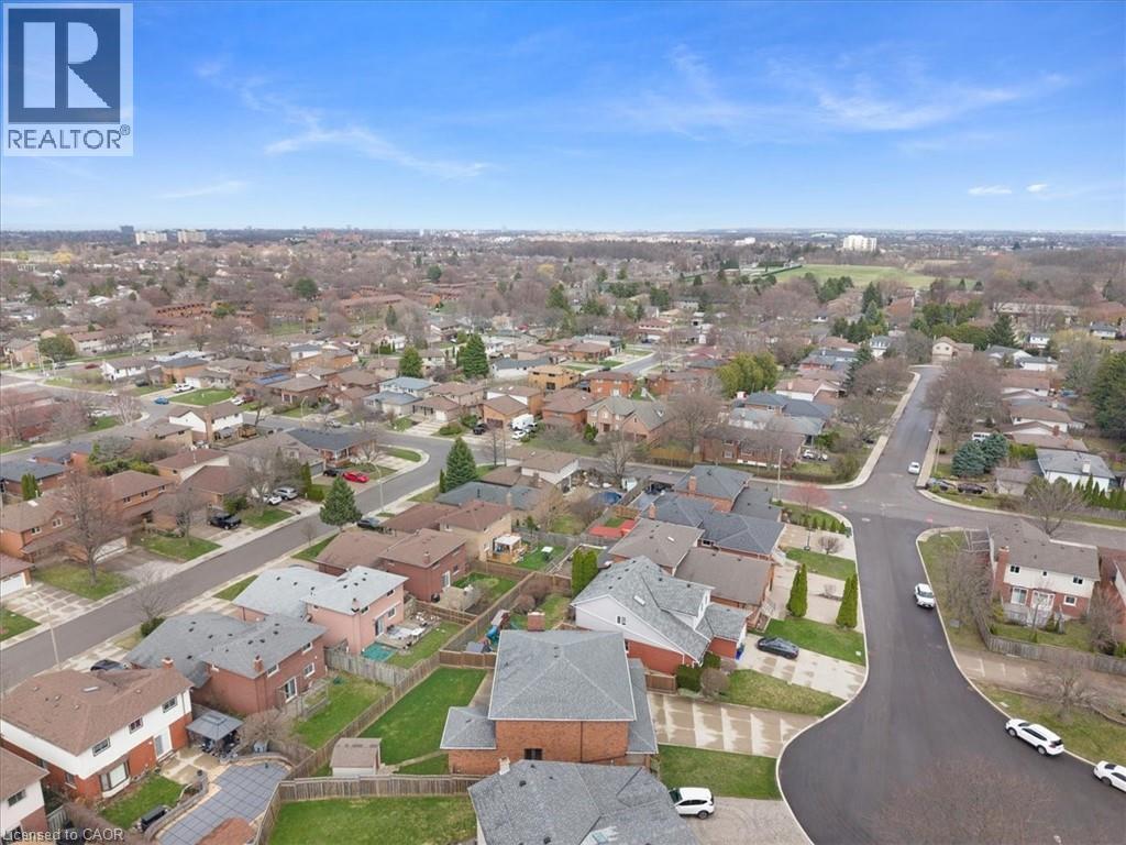 Aerial view showcasing the residential neighbourhood with streets and houses - 18 Marcel Place, Hamilton, ON - Outdoor With View