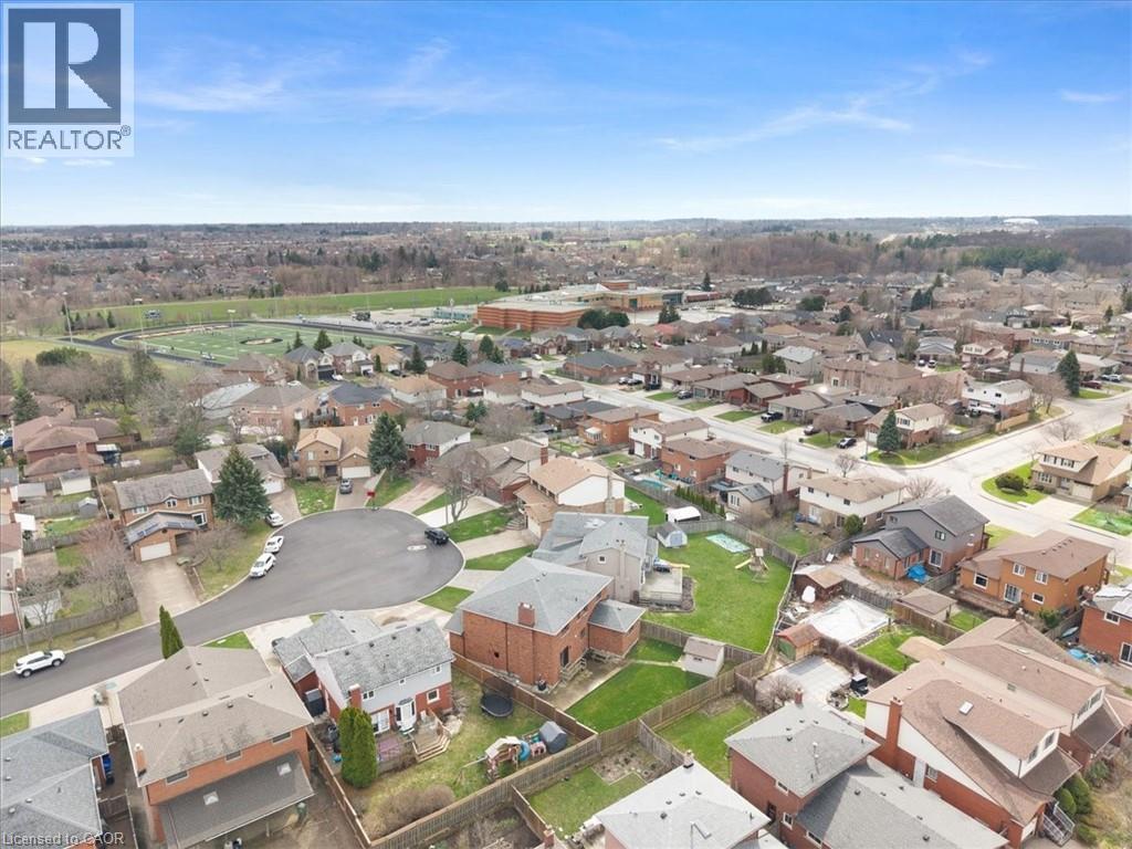 Aerial view of the neighborhood showcasing a cul-de-sac and residential properties with green spaces - 18 Marcel Place, Hamilton, ON - Outdoor With View