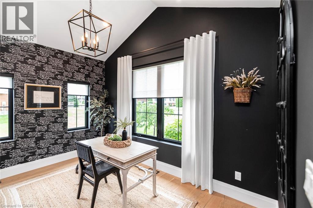 Vaulted ceiling with a geometric pendant light fixture - 253 Central Avenue, Grimsby, ON