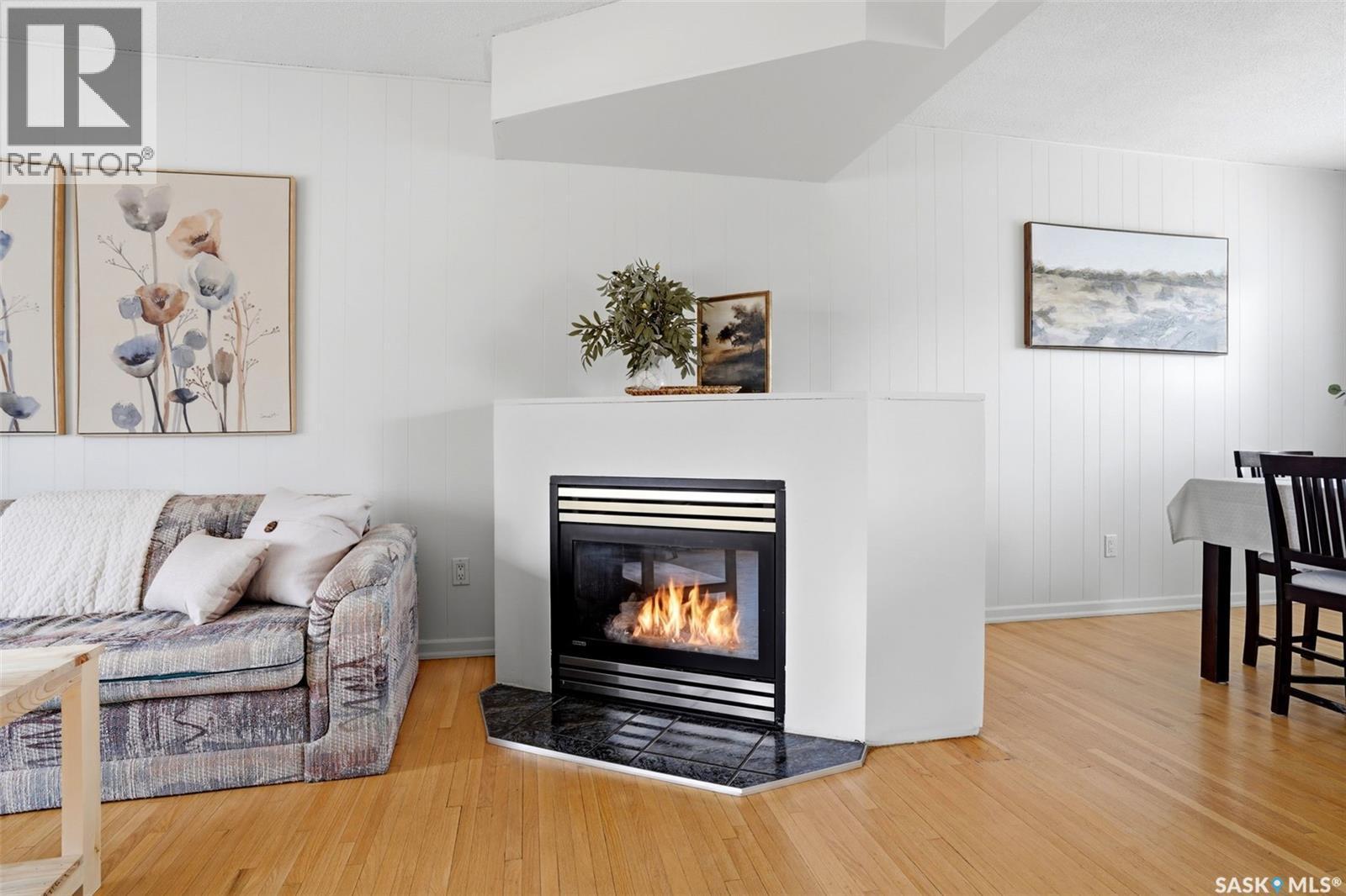25 Knowles Crescent, Regina, SK - Indoor Photo Showing Living Room With Fireplace