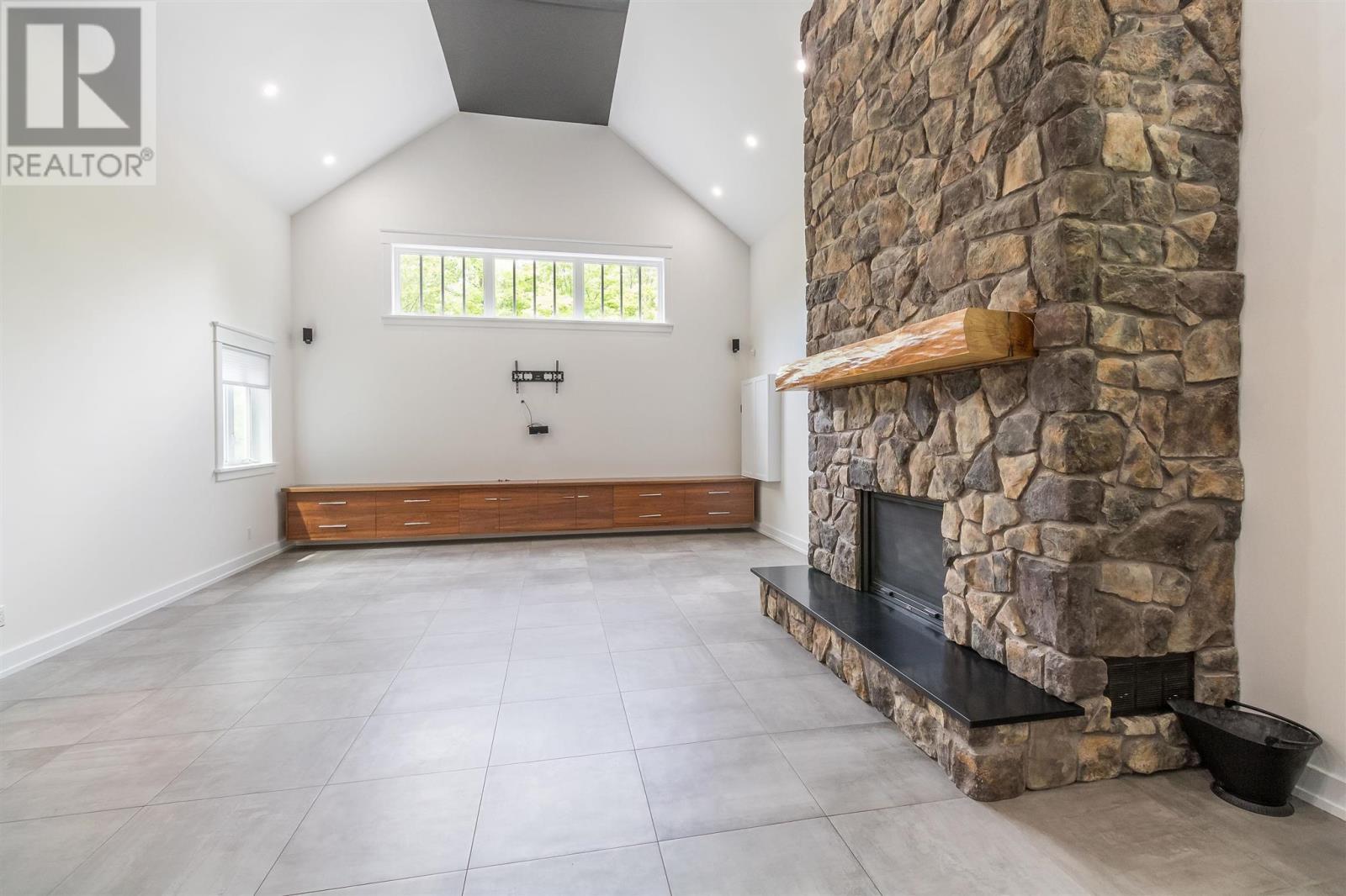 400 Mccarrel Lake Rd, Echo Bay, ON - Indoor Photo Showing Other Room With Fireplace