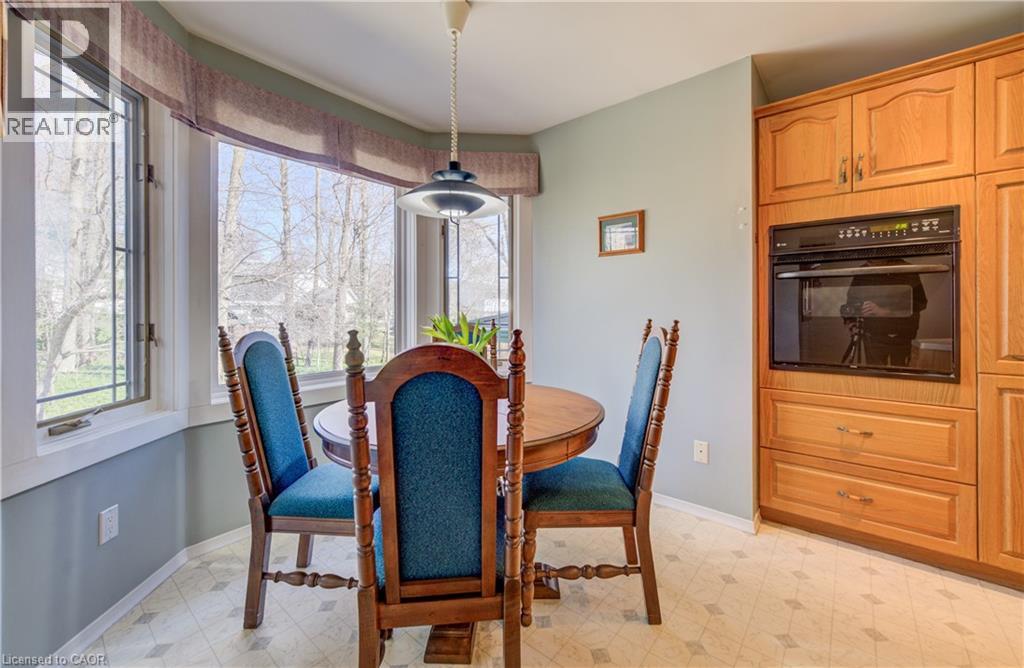 Enjoy your morning coffee watching the birds overlooking your wooded back yard. - 564 Glen Manor Boulevard, Waterloo, ON - Indoor Photo Showing Dining Room