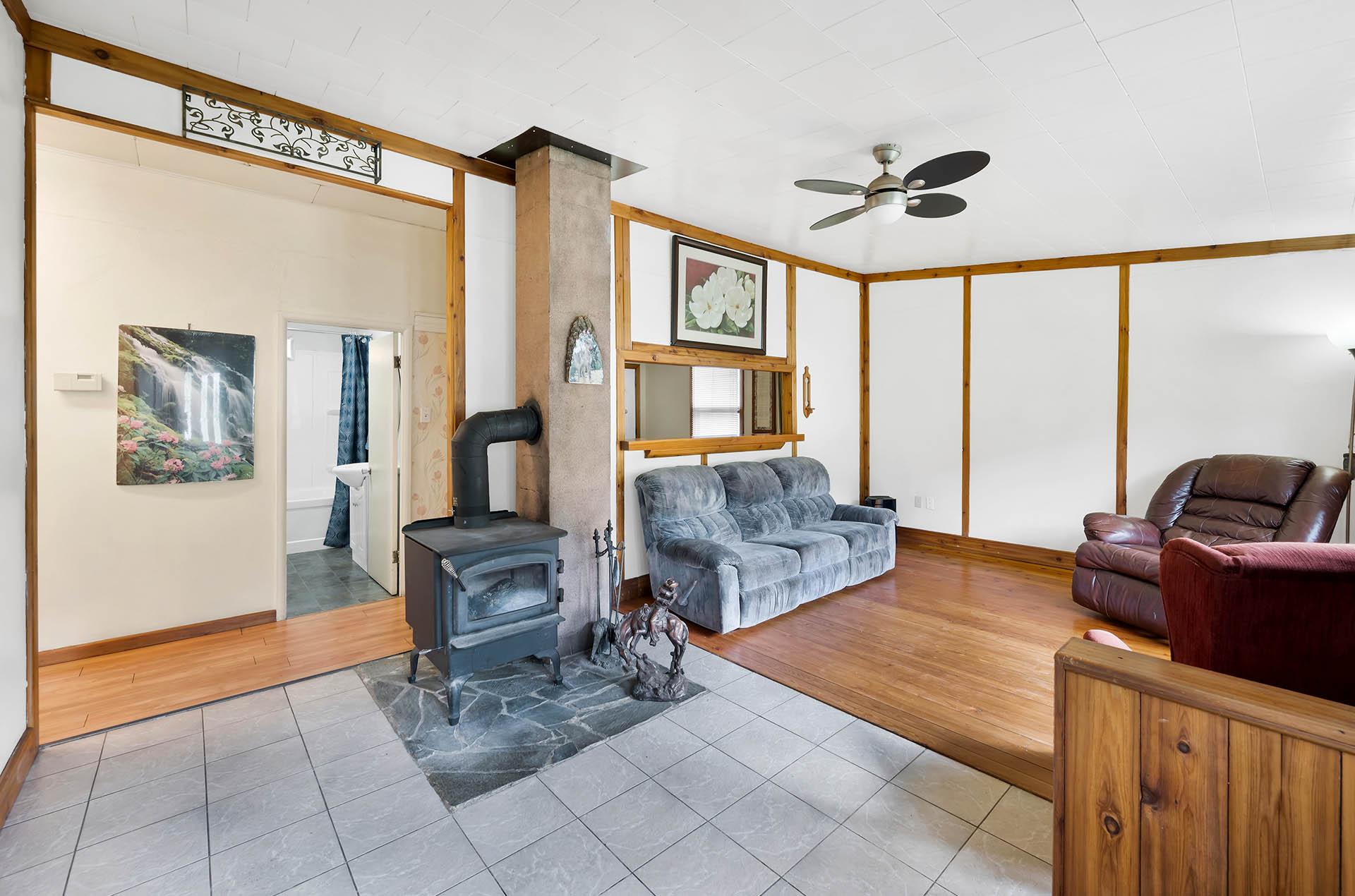 3782 River Drive, Blue River, BC - Indoor Photo Showing Living Room With Fireplace