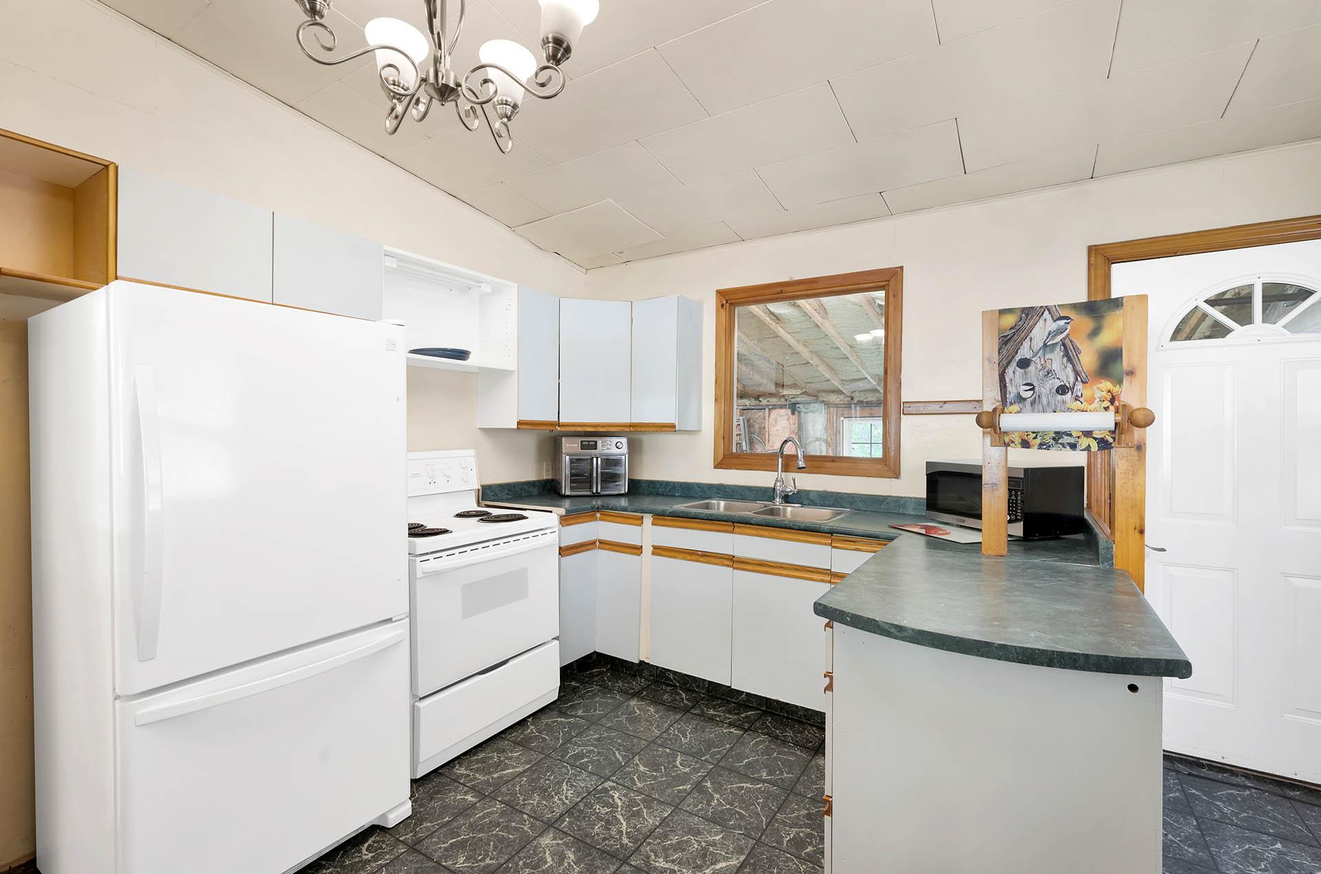 3782 River Drive, Blue River, BC - Indoor Photo Showing Kitchen With Double Sink