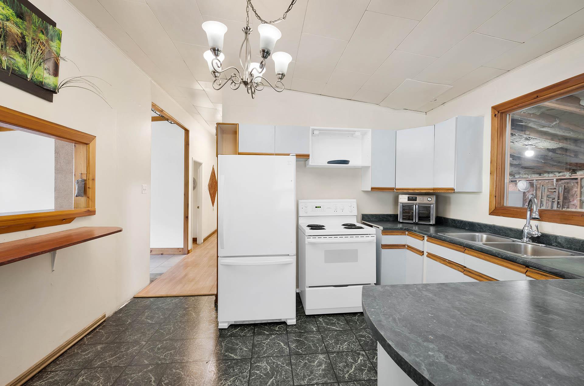 3782 River Drive, Blue River, BC - Indoor Photo Showing Kitchen With Double Sink