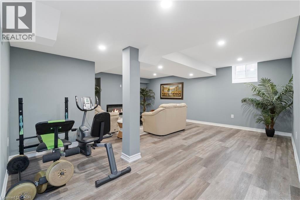 Spacious room with light gray walls, recessed lighting, and carpet free - 4 Macbean Crescent, Waterdown, ON - Indoor Photo Showing Gym Room
