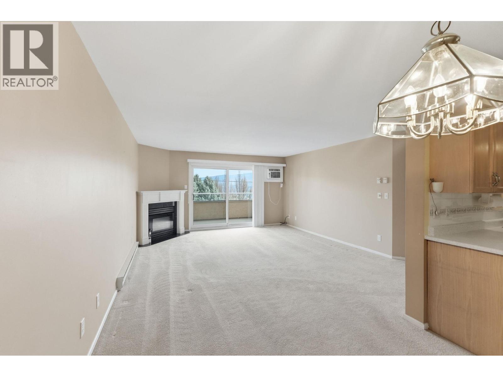 3850 Brown Road Unit# 203, West Kelowna, BC - Indoor With Fireplace
