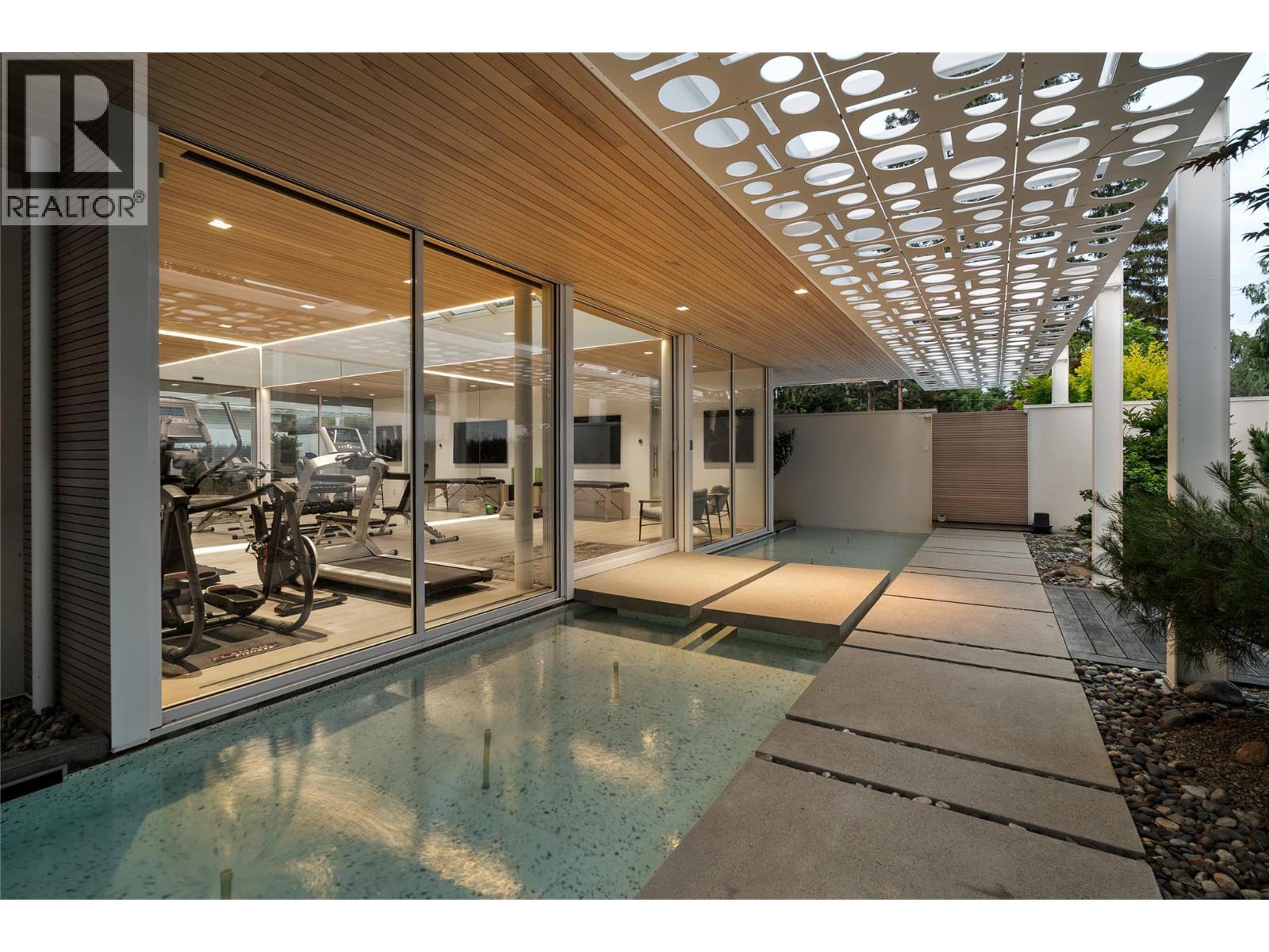 Floating concrete bridge into gym - 4110 Lakeshore Road, Kelowna, BC -