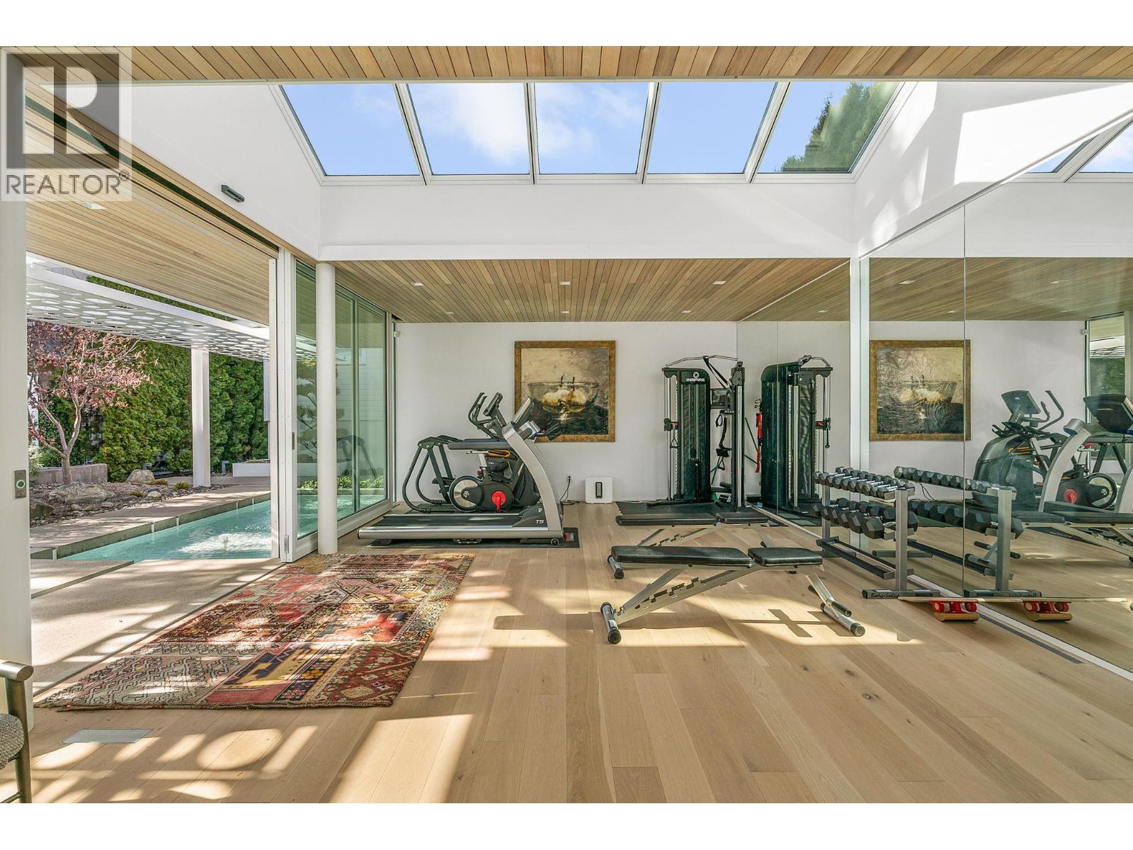 Skylights imported from Denmark - 4110 Lakeshore Road, Kelowna, BC - Indoor Photo Showing Gym Room