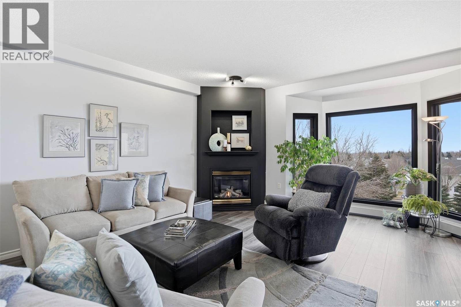 432 325 Keevil Crescent, Saskatoon, SK - Indoor Photo Showing Living Room With Fireplace