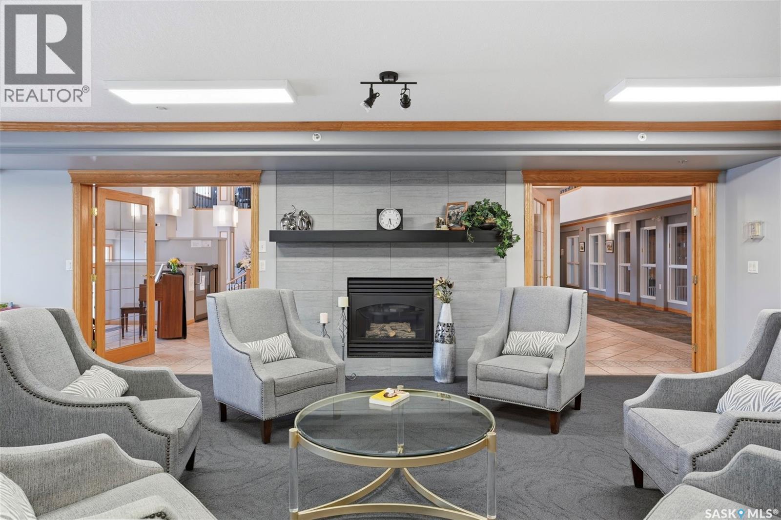 432 325 Keevil Crescent, Saskatoon, SK - Indoor Photo Showing Living Room With Fireplace