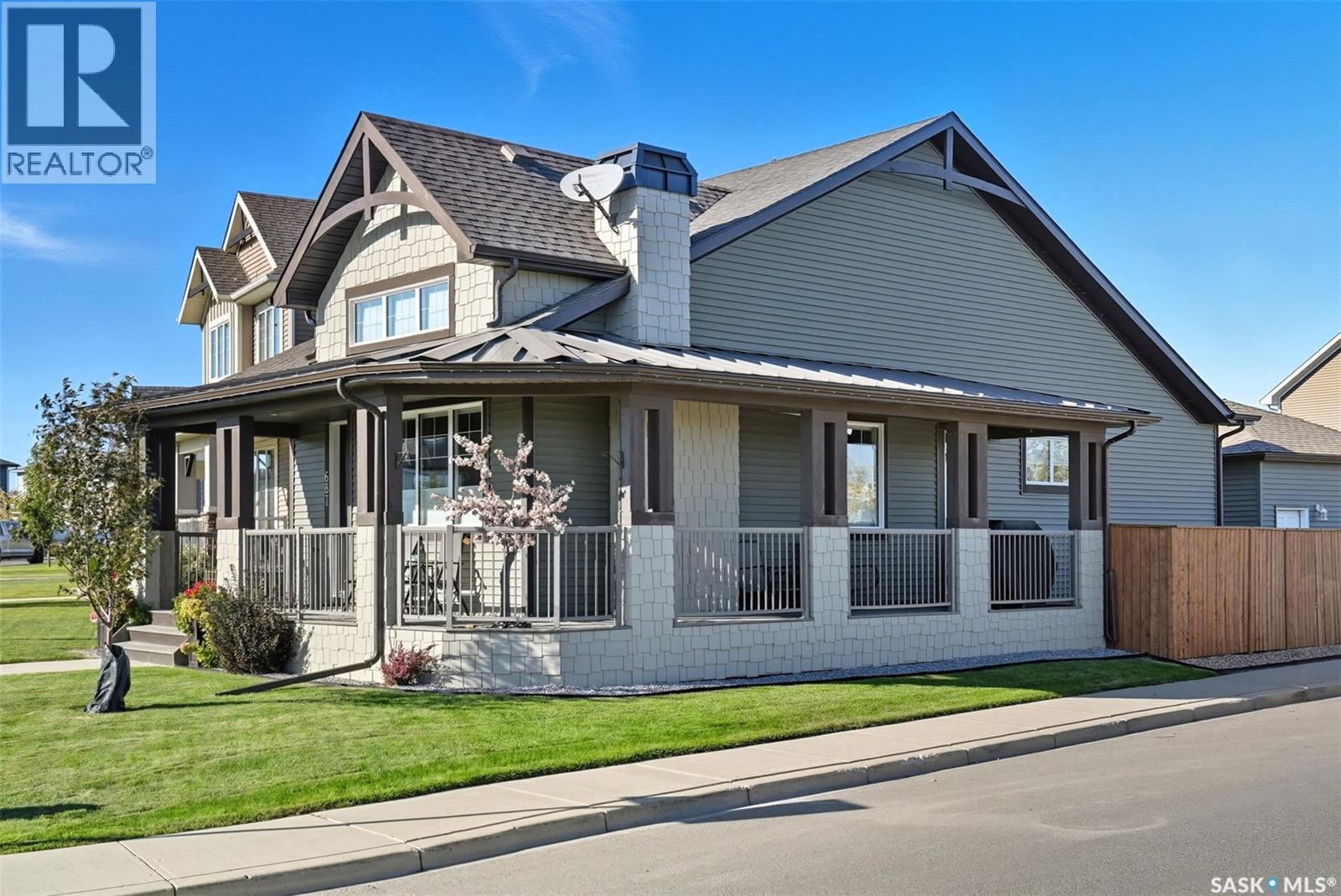 687 Secord Bend, Saskatoon, SK - Outdoor With Deck Patio Veranda With Facade