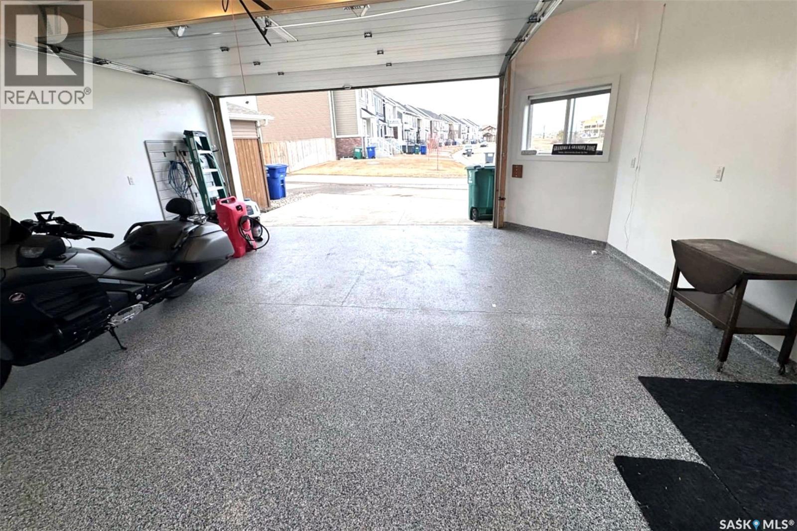 687 Secord Bend, Saskatoon, SK - Indoor Photo Showing Garage