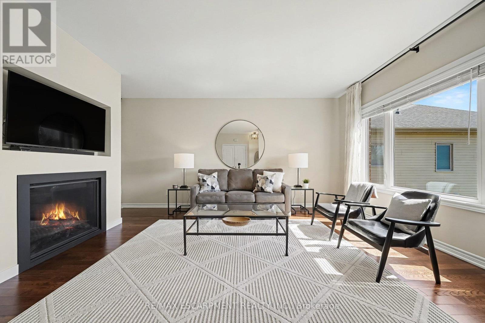 7 Senators Gate Drive, Perth, ON - Indoor Photo Showing Living Room With Fireplace